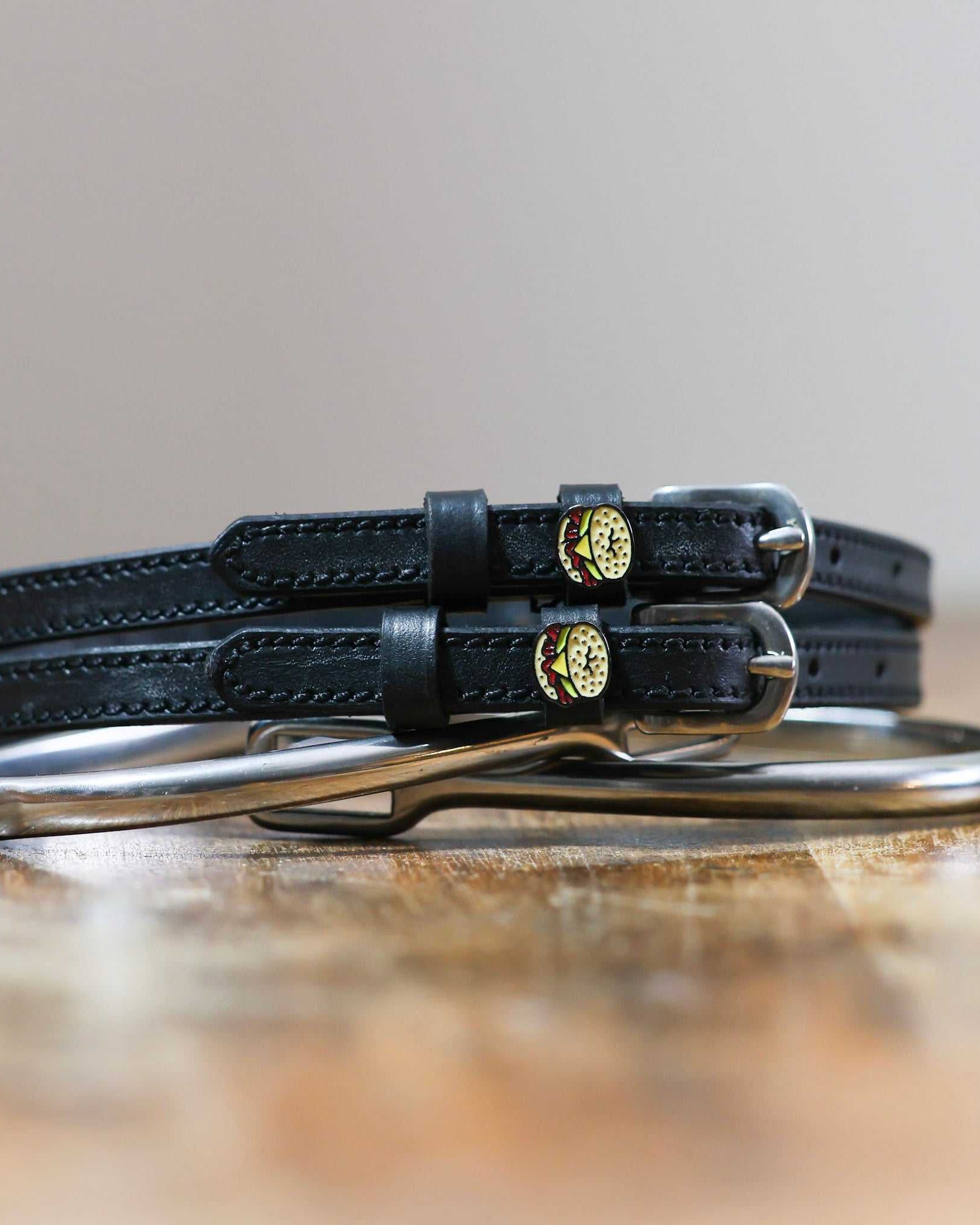 ManeJane Bagel Sandwich Spur Straps Spur Straps — black leather, non-stretch, hero image for English riders.