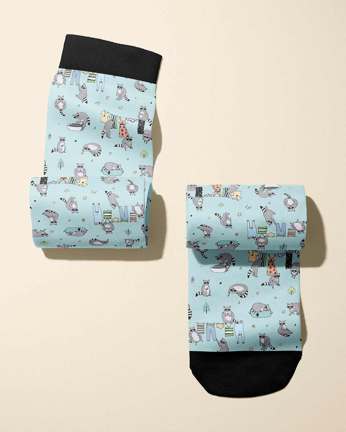 Limited edition Masked Bandit boot socks with playful raccoon design, soft stretchy fabric, made in USA