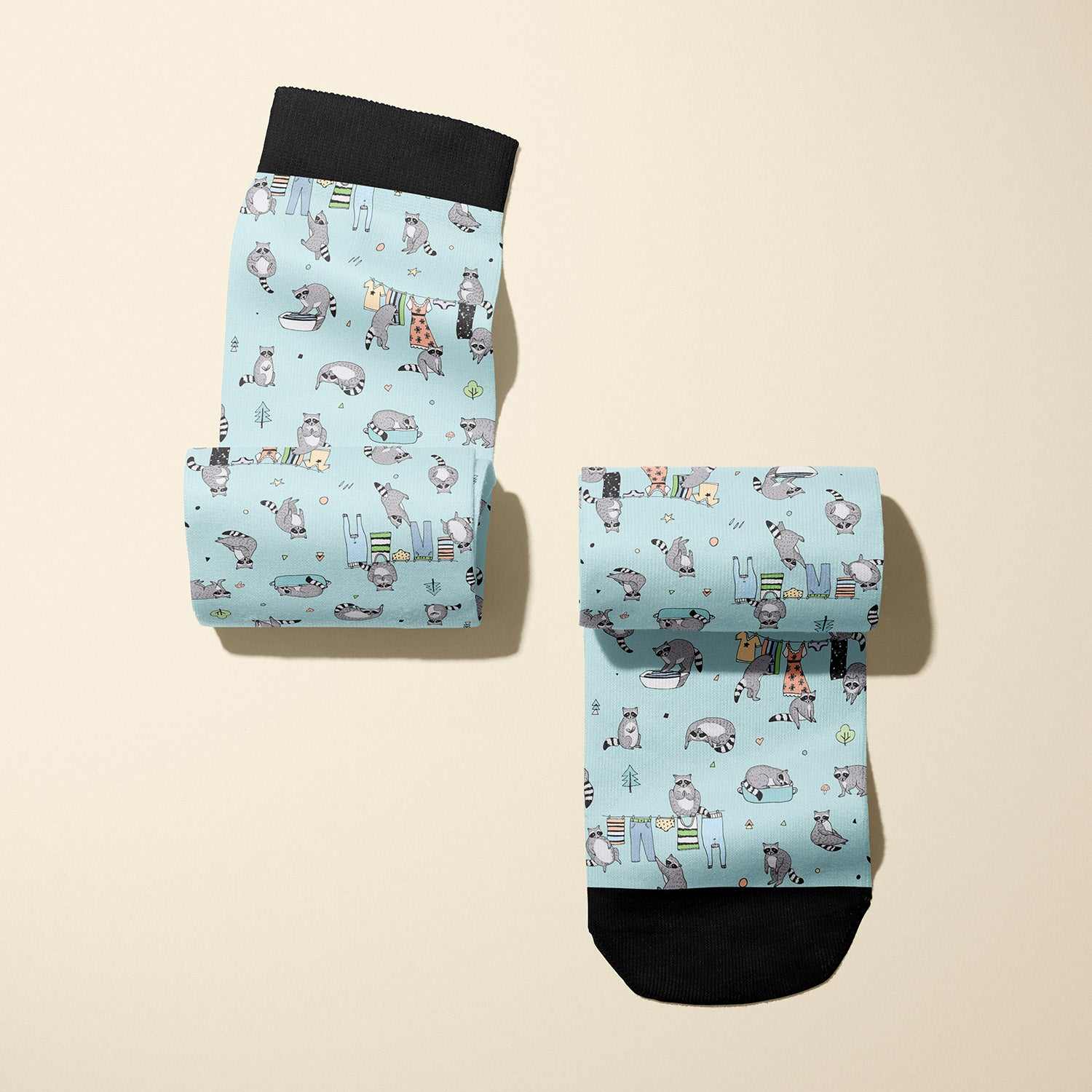 Limited edition Masked Bandit boot socks with playful raccoon design, soft stretchy fabric, made in USA