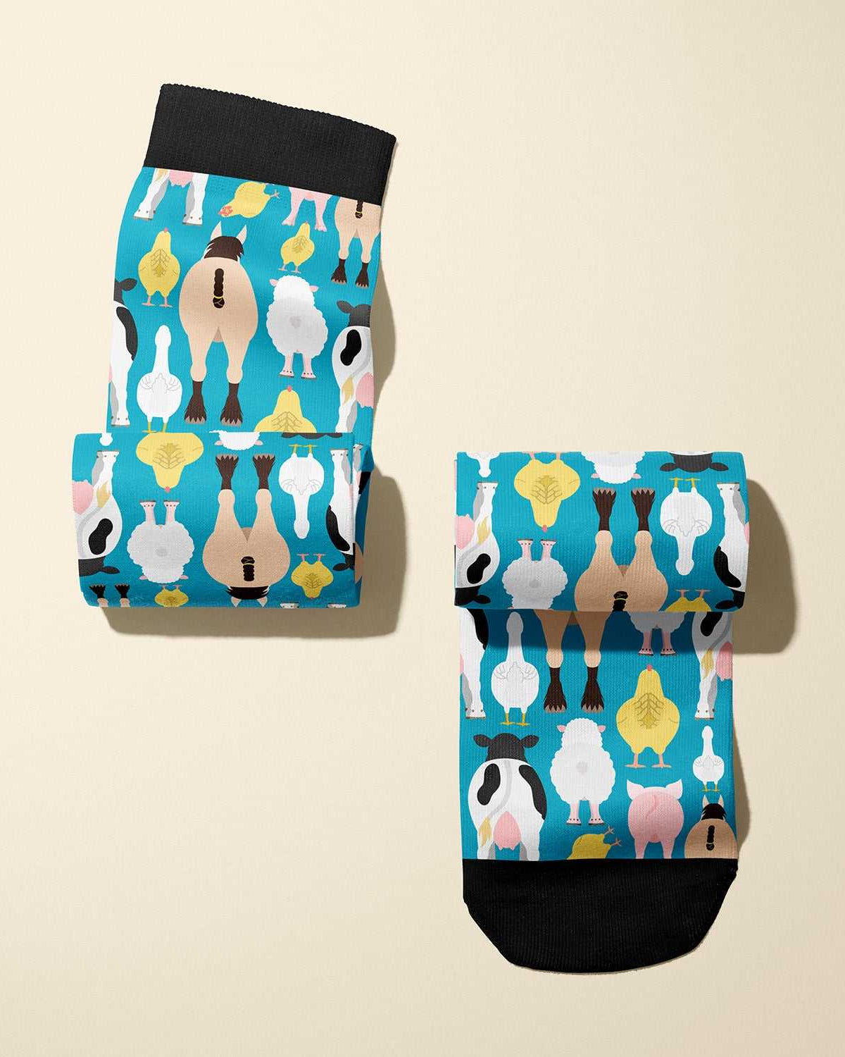 Limited edition Farm Butts 2023 boot socks featuring cheeky farm animal designs, soft and stretchy, made in the USA.