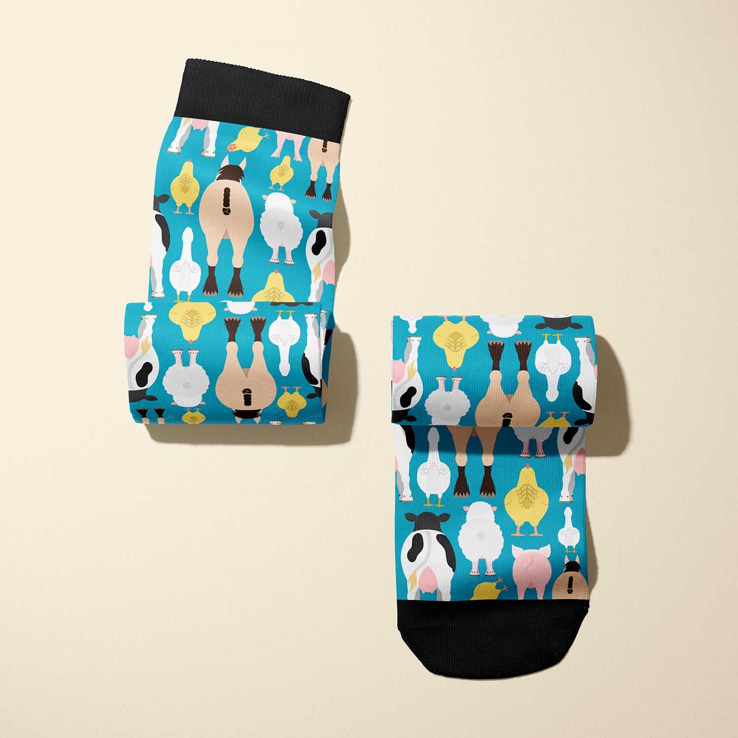 Limited edition Farm Butts 2023 boot socks featuring cheeky farm animal designs, soft and stretchy, made in the USA.
