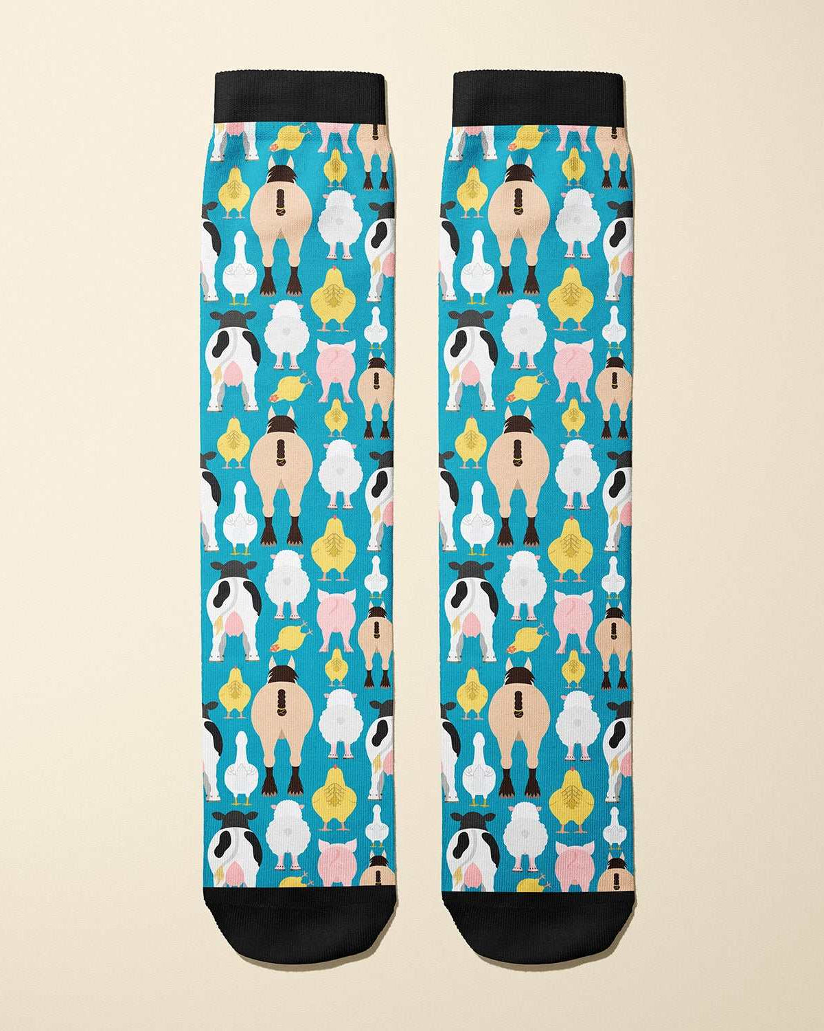 Limited edition Farm Butts 2023 boot socks featuring cheeky farm animal designs, made in the USA.