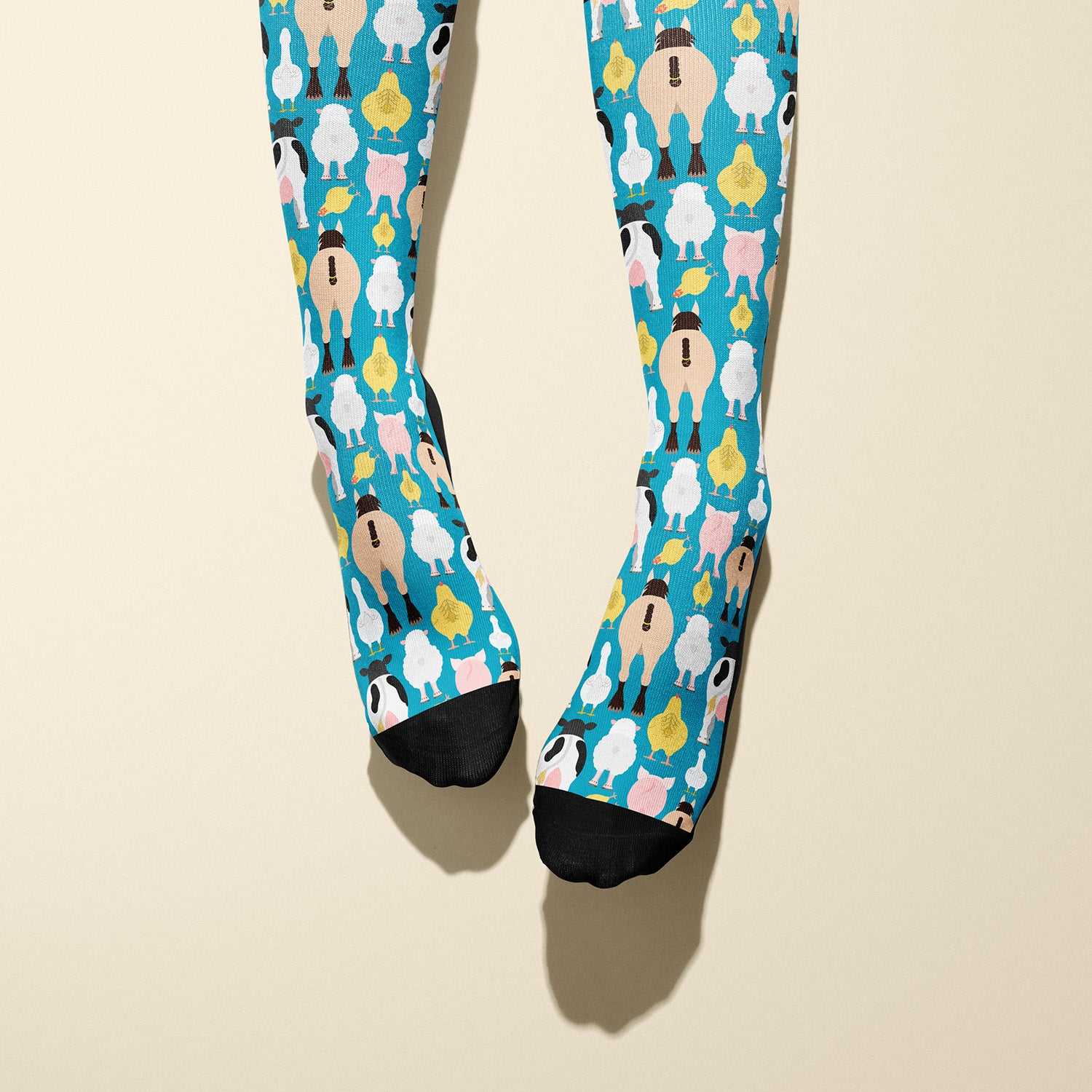 Limited edition Farm Butts 2023 boot socks featuring cheeky farm animal designs, made in the USA.