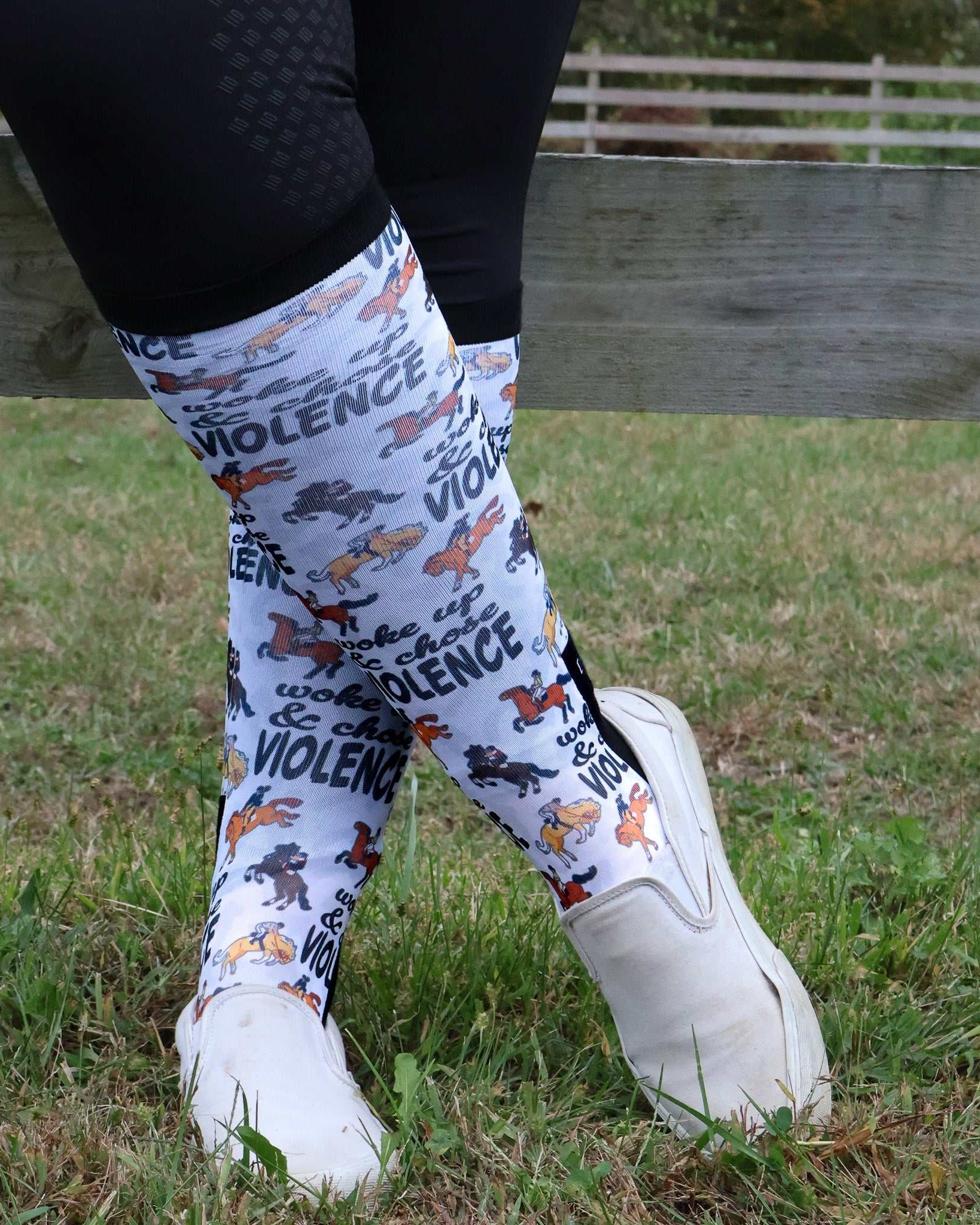 Limited edition Woke Up Chose Violence boot socks with bold text and colorful dog illustrations, made in the USA