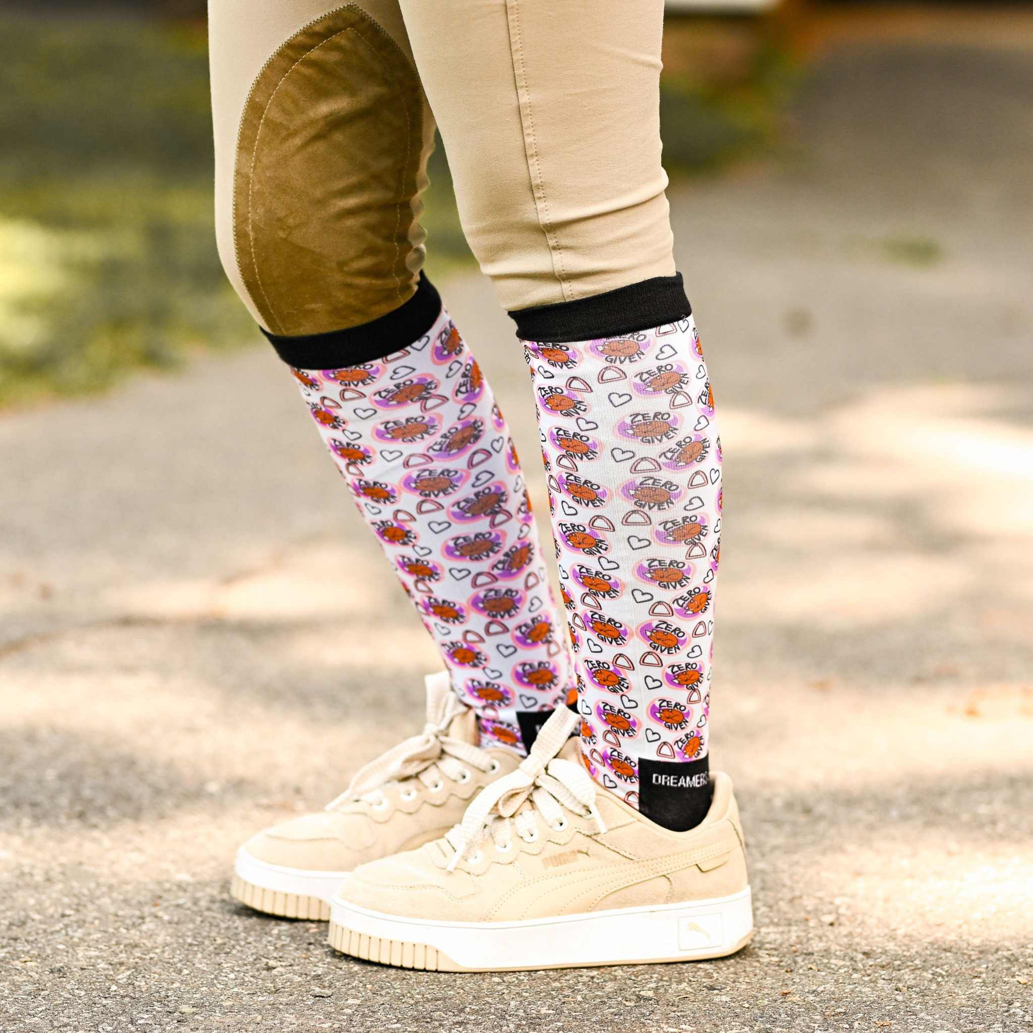 Zero Fox Given Bundle knee-high socks with sassy fox design worn with beige riding pants and cream sneakers