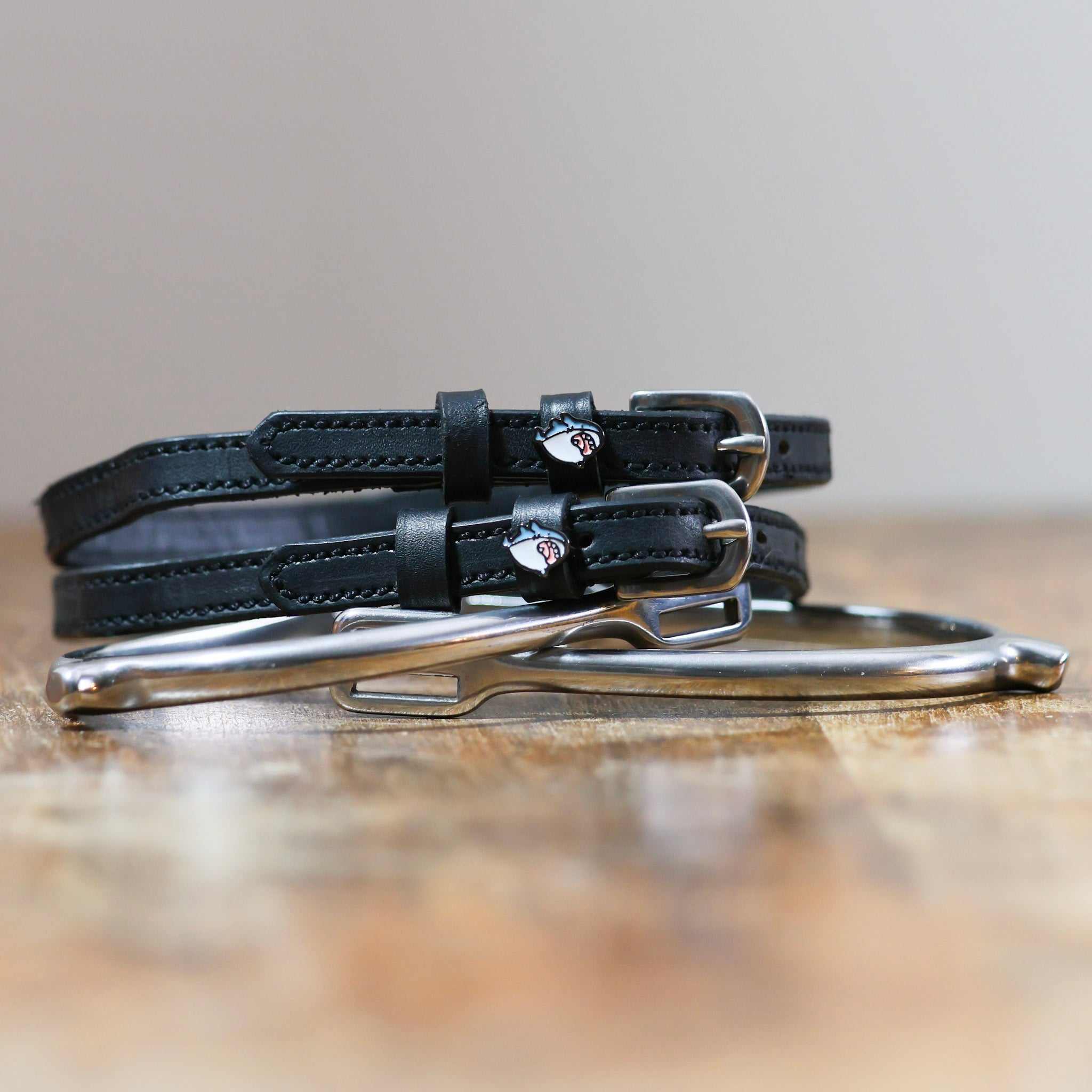 ManeJane Wild Shark Spur Straps Spur Straps — black leather, non-stretch, hero image for English riders.
