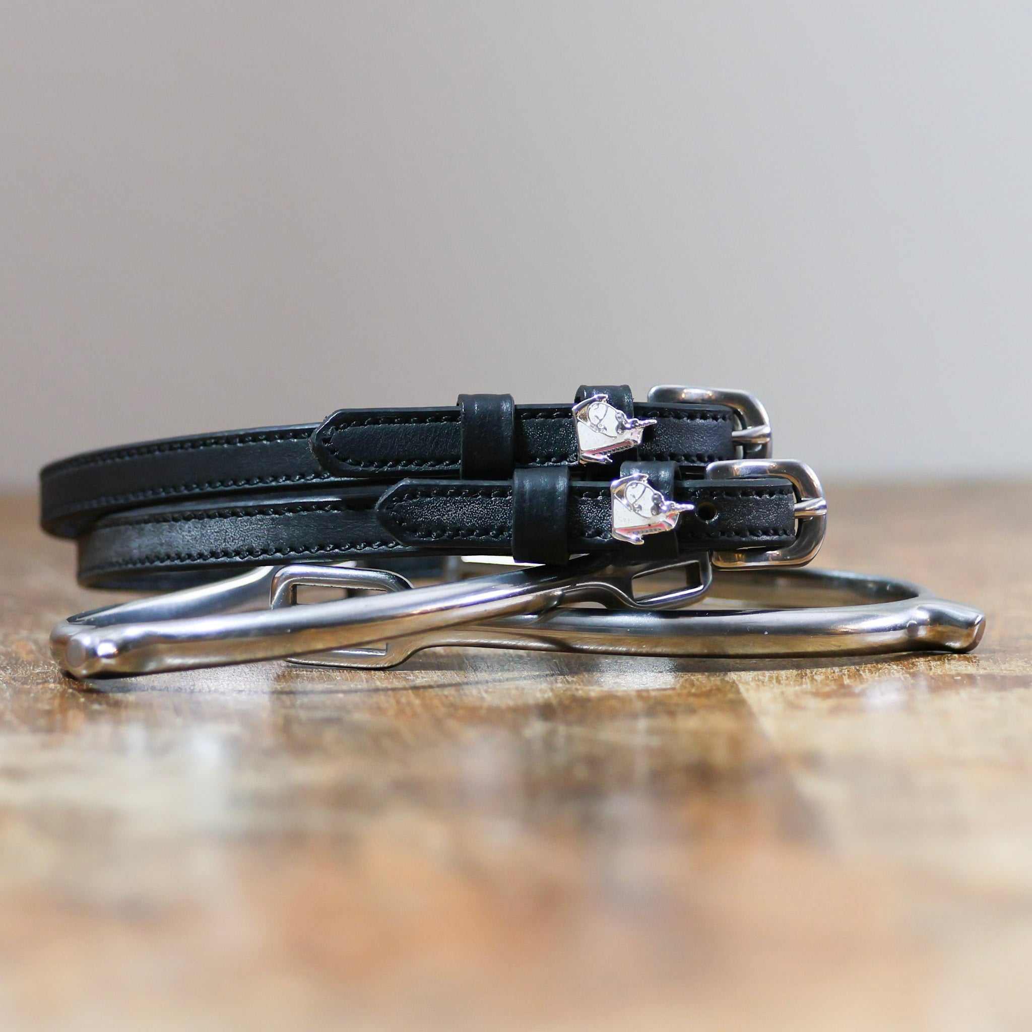 ManeJane Sassy Unicorn Spur Straps Spur Straps — black leather, non-stretch, hero image for English riders.