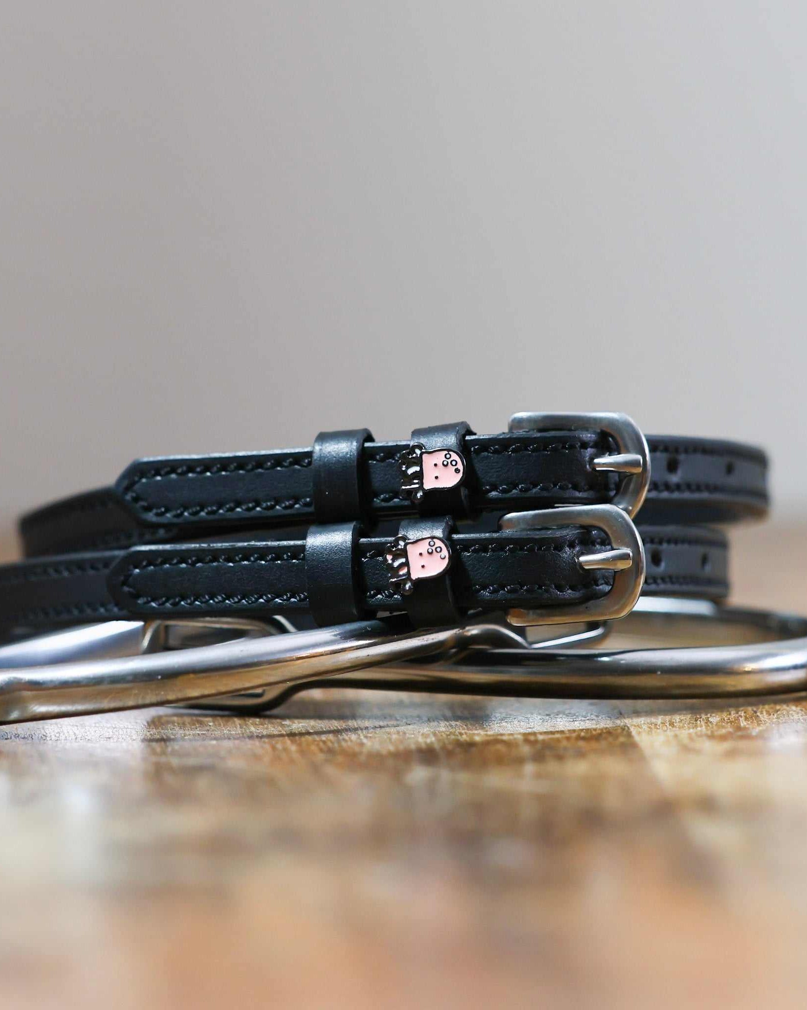 ManeJane Octopus Spur Straps Spur Straps — black leather, non-stretch, hero image for English riders.