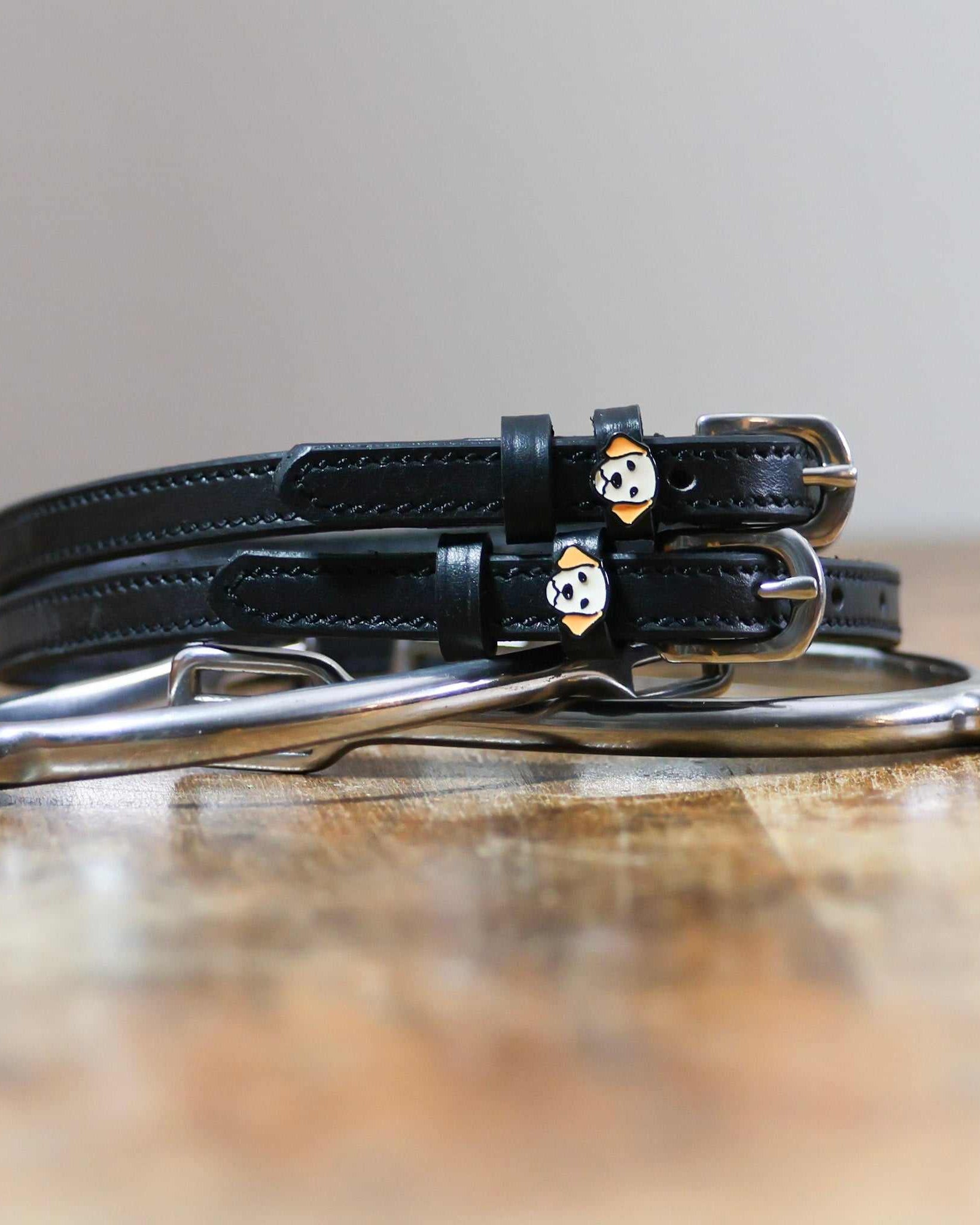ManeJane Dog - Golden Retriever Spur Straps Spur Straps — black leather, non-stretch, hero image for English riders.