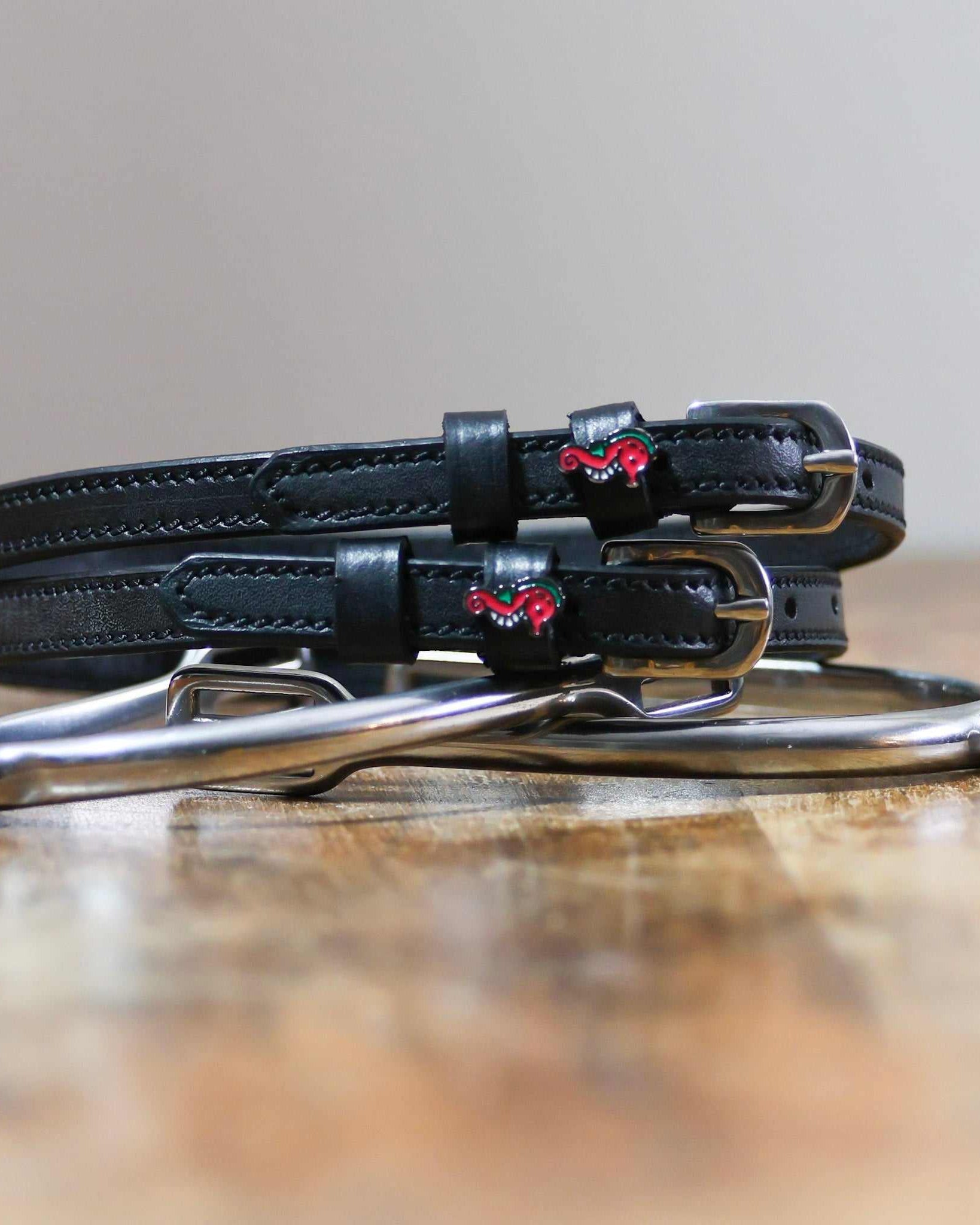 ManeJane Seahorse Spur straps Spur Straps — black leather, non-stretch, hero image for English riders.