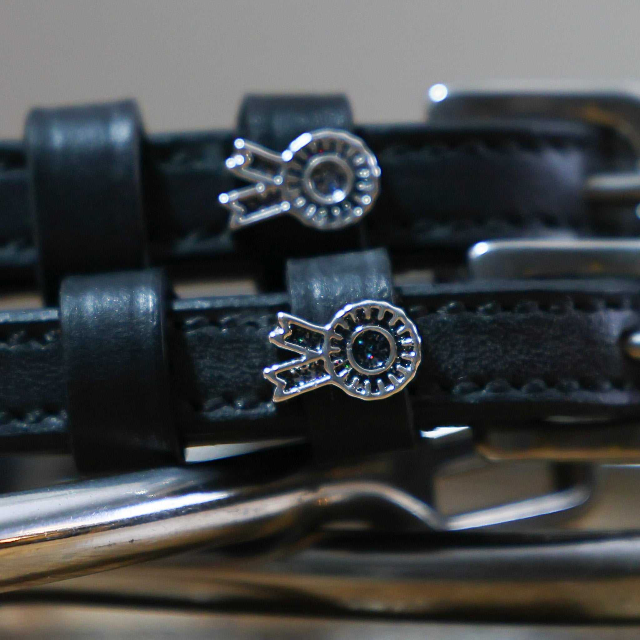 Black leather Rosette Spur Straps with stainless steel buckles and custom floral charms