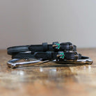 ManeJane Palm Tree Spur Straps Spur Straps — black leather, non-stretch, hero image for English riders.