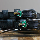 Black leather Palm Tree Spur Straps with green palm tree charm and stainless steel buckles