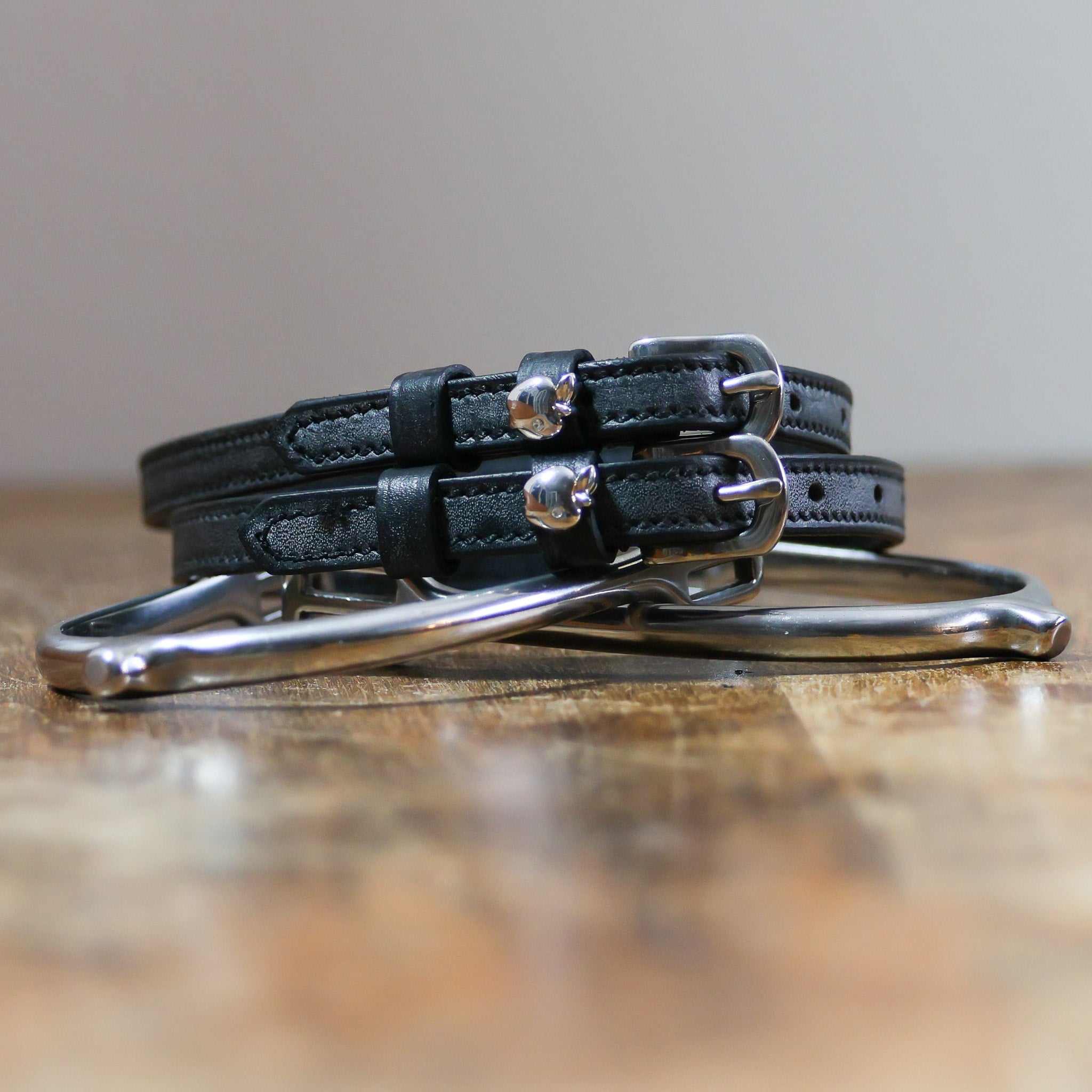 ManeJane Silver Apple Spur Straps Spur Straps — black leather, non-stretch, hero image for English riders.