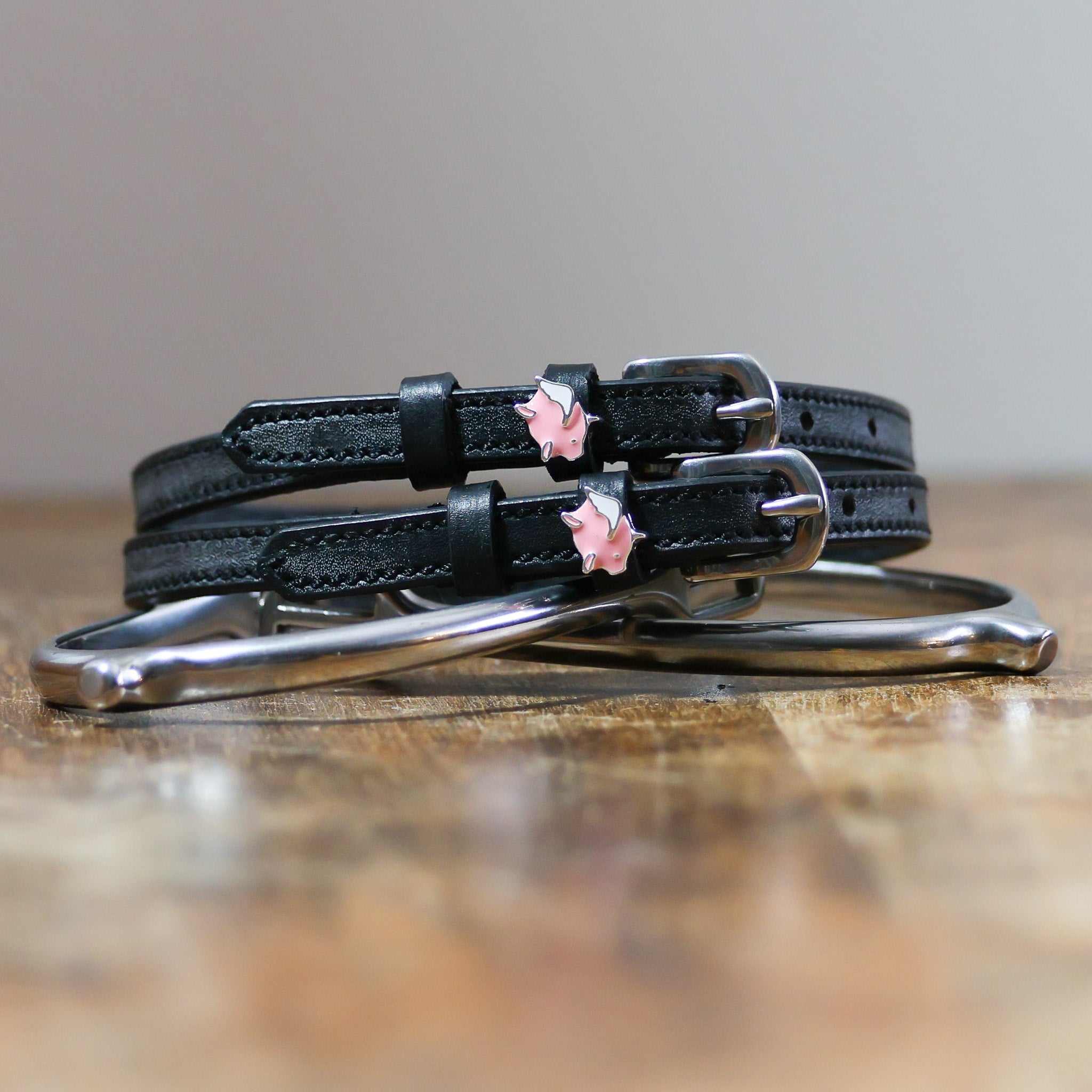 ManeJane Pigs Fly Spur Straps Spur Straps — black leather, non-stretch, hero image for English riders.