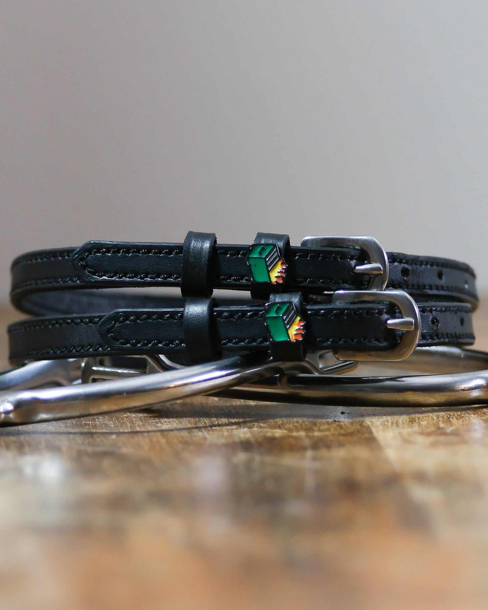 ManeJane Dumpster Fire Spur Straps Spur Straps — black leather, non-stretch, hero image for English riders.