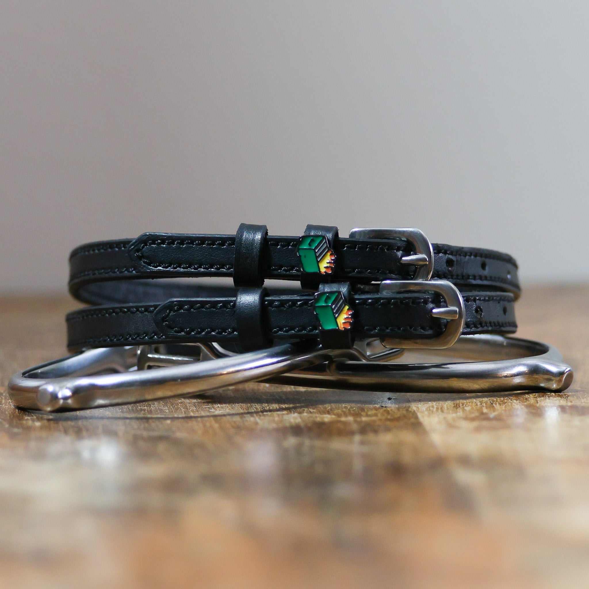 ManeJane Dumpster Fire Spur Straps Spur Straps — black leather, non-stretch, hero image for English riders.