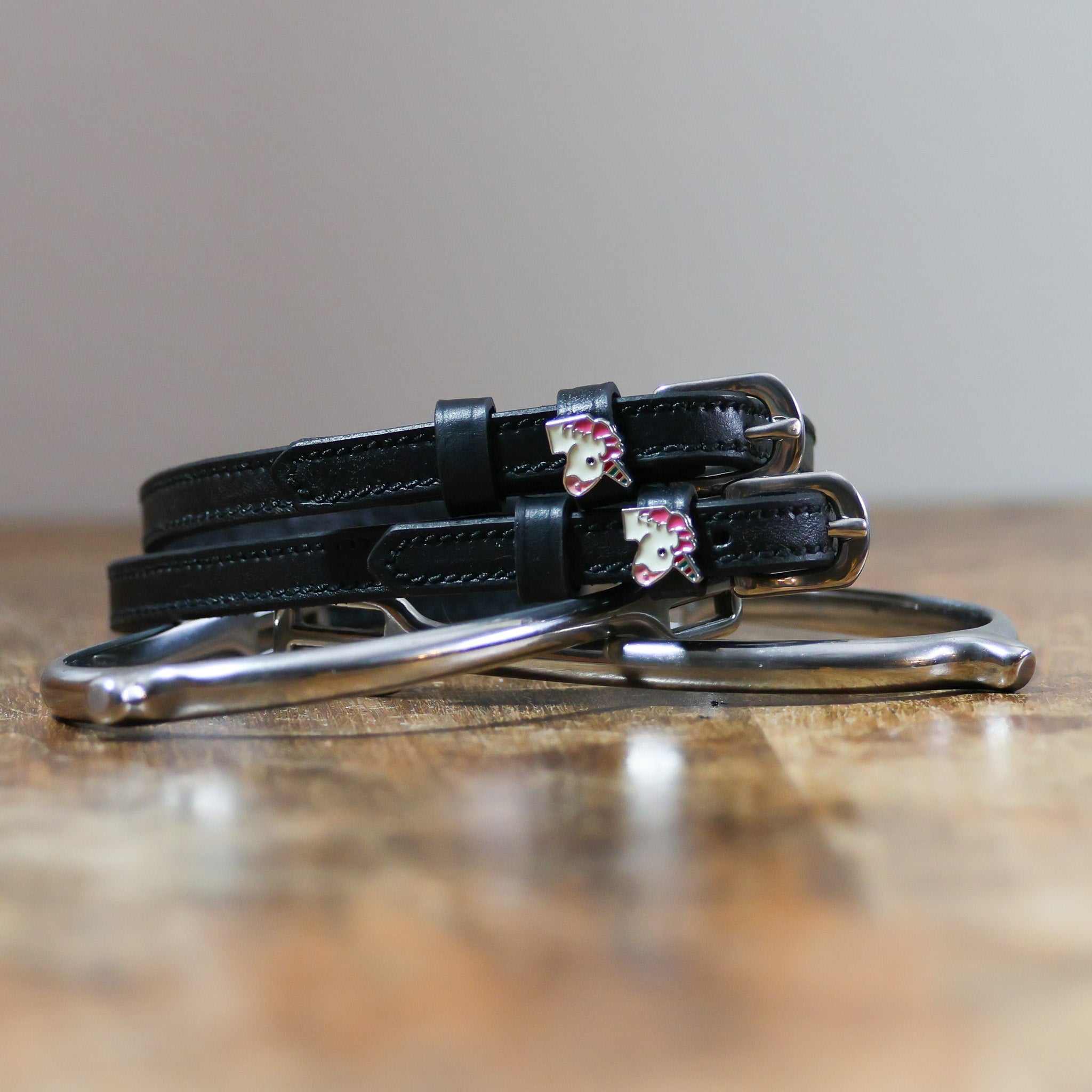 ManeJane Unicorn Emoji Spur Straps Spur Straps — black leather, non-stretch, hero image for English riders.