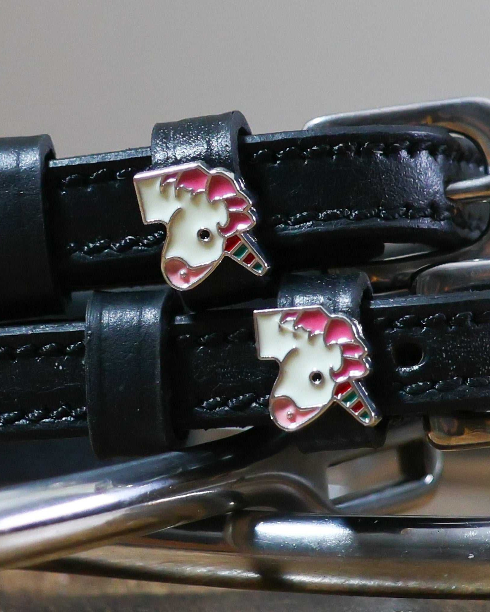 black leather Unicorn Emoji Spur Straps with stainless steel buckle and custom unicorn charm