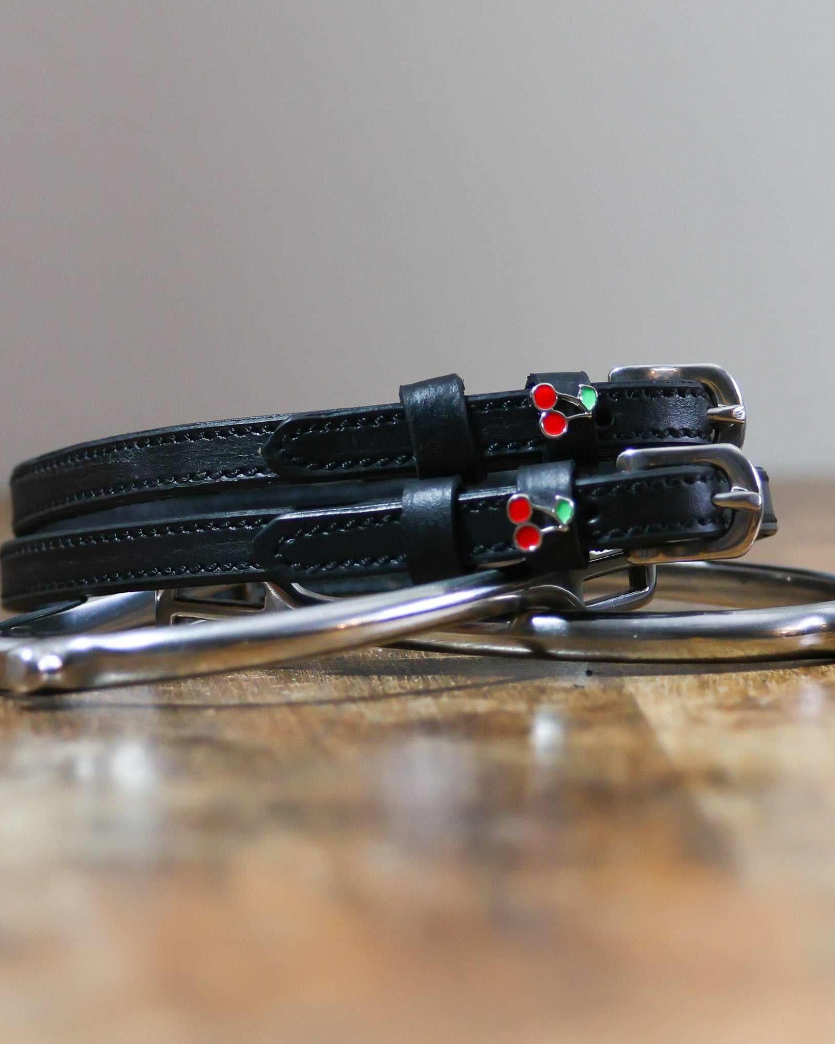 ManeJane Cherry Spur Straps Spur Straps — black leather, non-stretch, hero image for English riders.