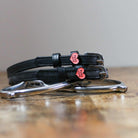 Black leather Pony Love Spur Straps with stainless steel buckles and heart-shaped charms