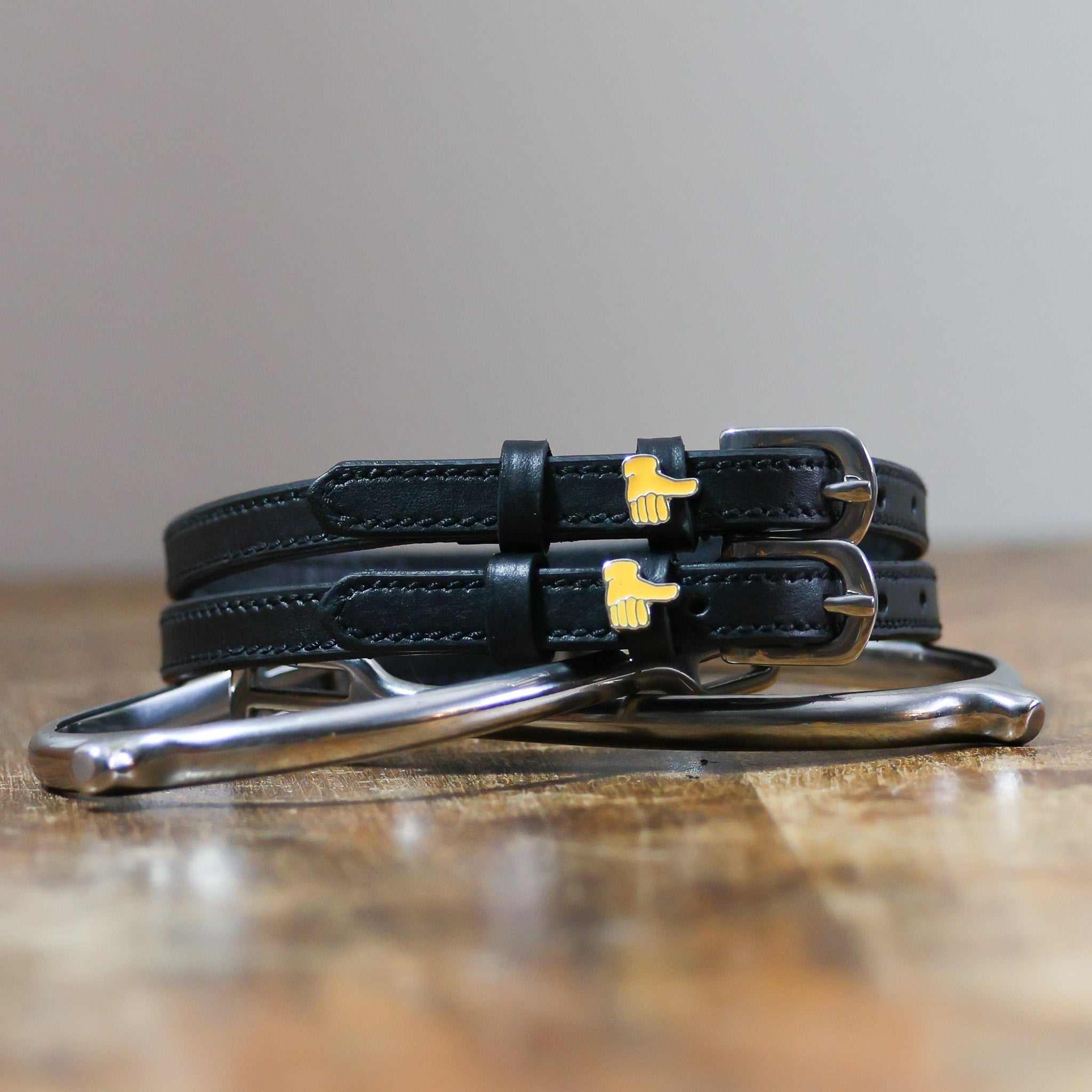 ManeJane Thumbs Up Emoji Spur Strap Spur Straps — black leather, non-stretch, hero image for English riders.