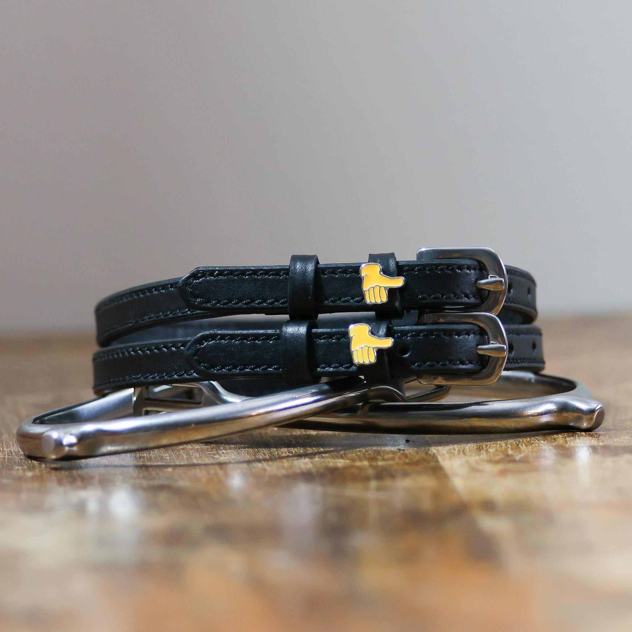 ManeJane Thumbs Up Emoji Spur Strap Spur Straps — black leather, non-stretch, hero image for English riders.