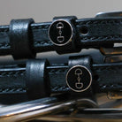 Black leather D-Ring Spur Straps with stainless steel buckle and custom ManeJane charm