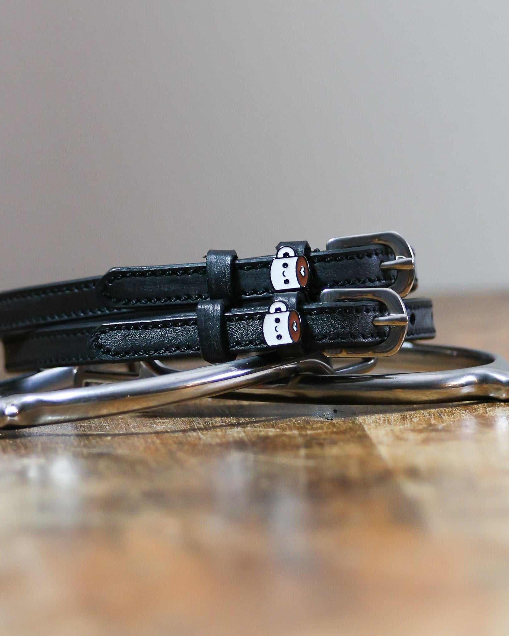 ManeJane Coffee Spur Straps Spur Straps — black leather, non-stretch, hero image for English riders.