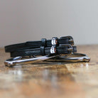 ManeJane Coffee Spur Straps Spur Straps — black leather, non-stretch, hero image for English riders.