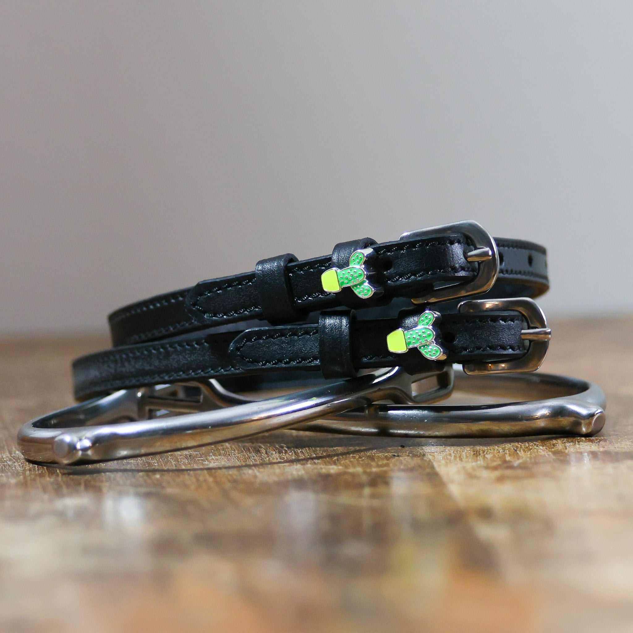 ManeJane Cactus Spur Straps Spur Straps — black leather, non-stretch, hero image for English riders.