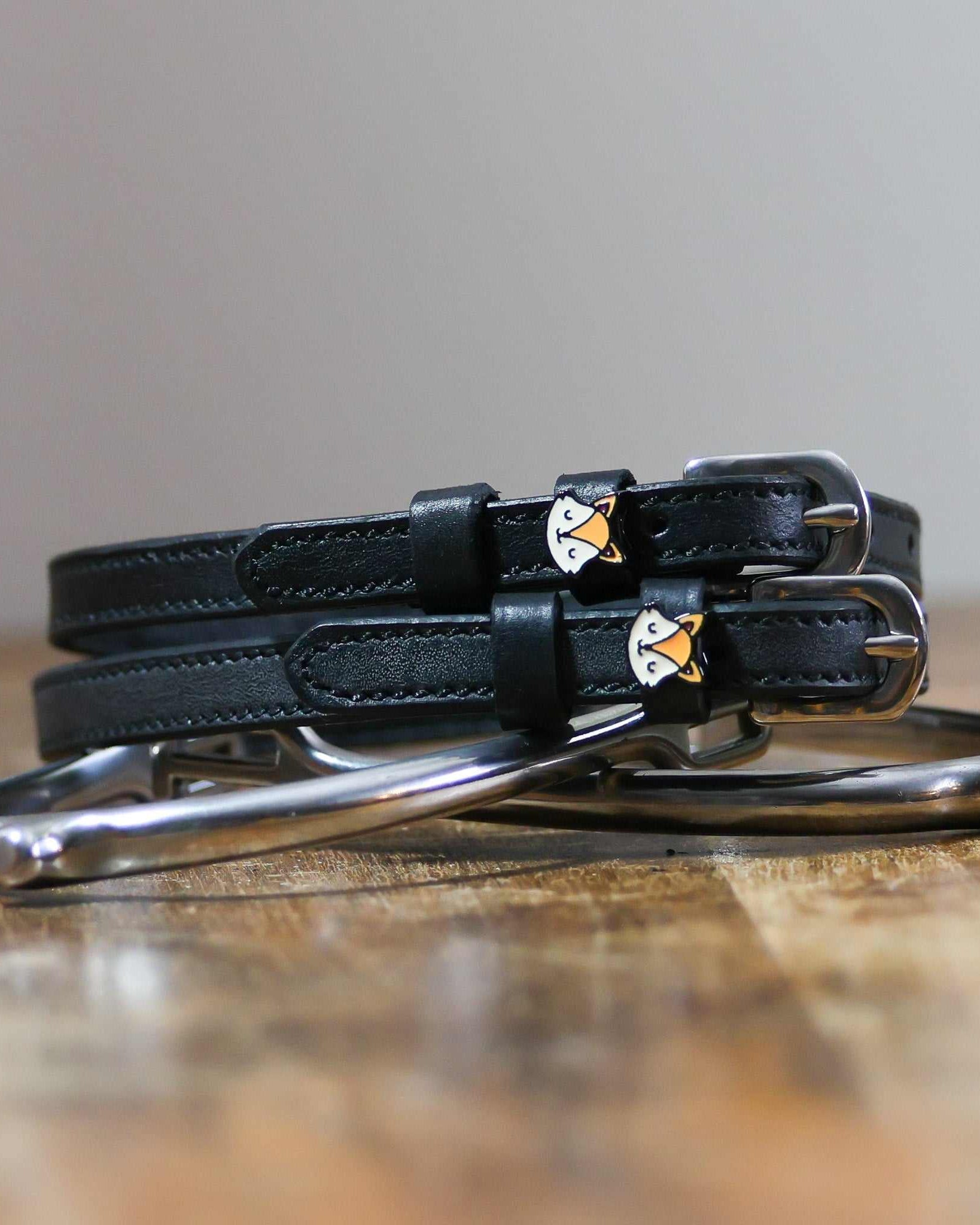 ManeJane Friendly Fox Spur Straps Spur Straps — black leather, non-stretch, hero image for English riders.