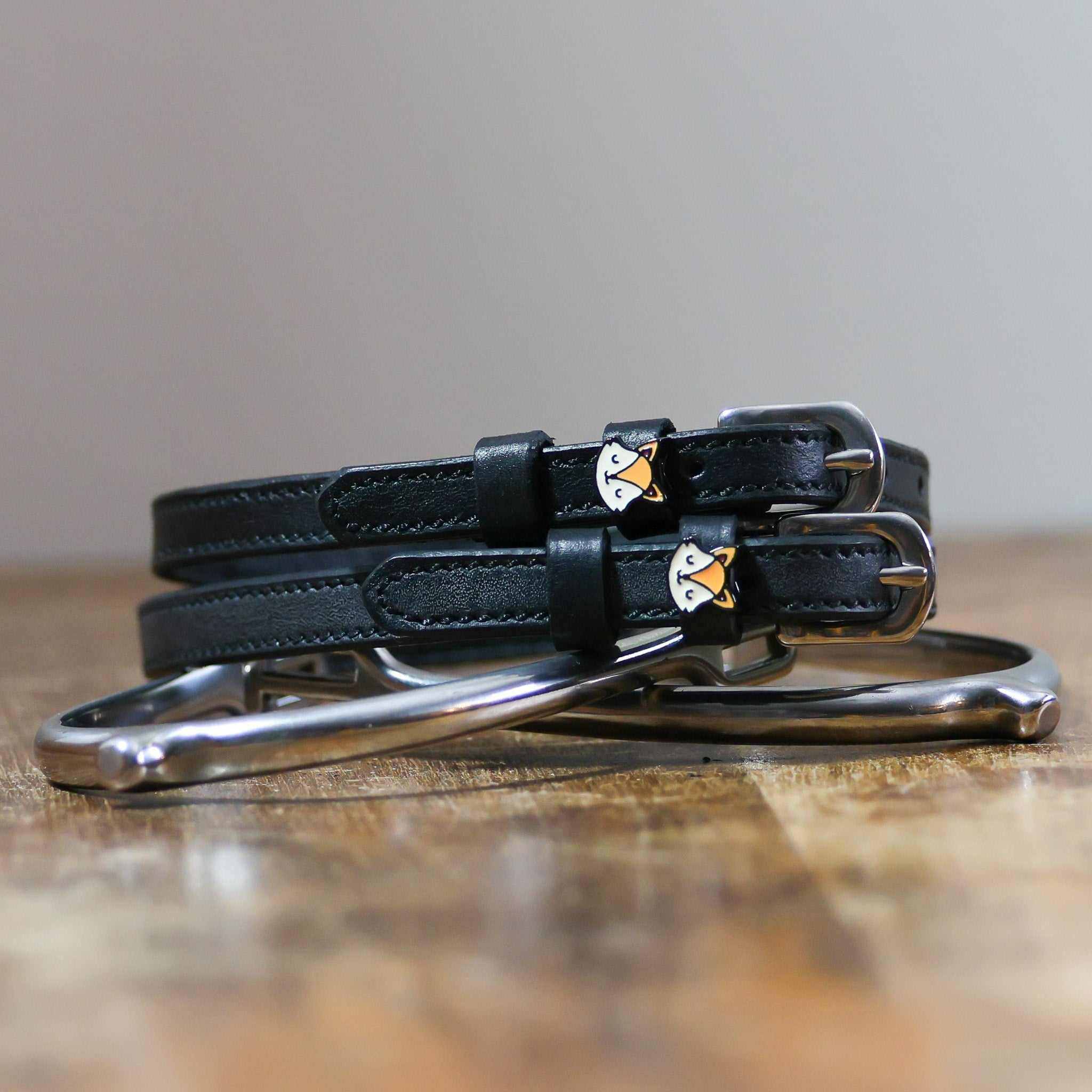 ManeJane Friendly Fox Spur Straps Spur Straps — black leather, non-stretch, hero image for English riders.