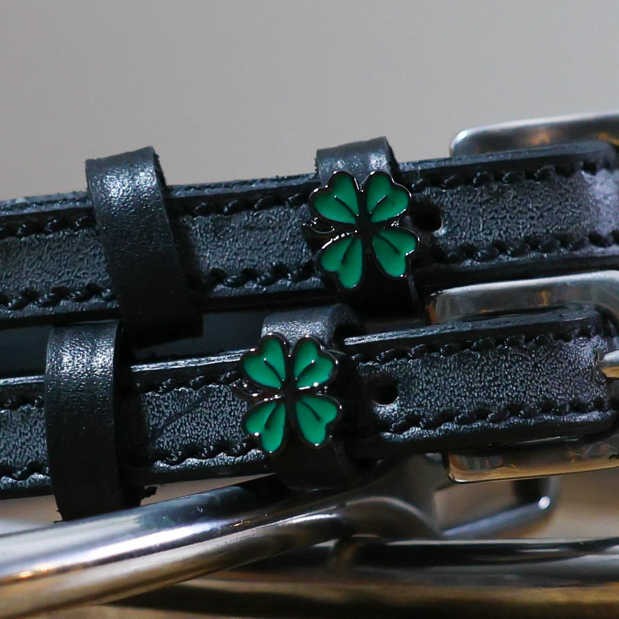 Black leather Four Leaf Clover Spur Strap with green clover charm and stainless steel buckle