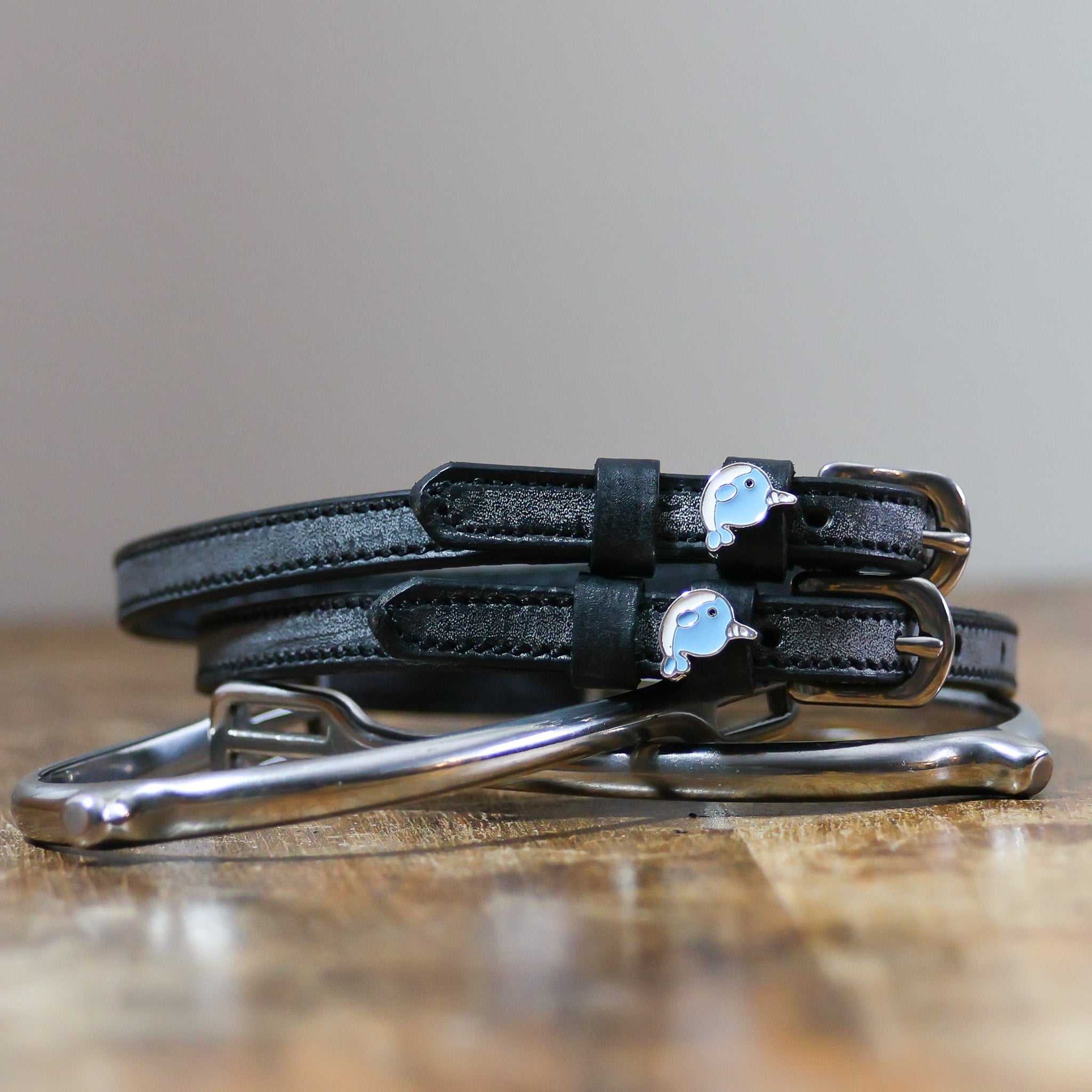 ManeJane Narwhal Spur Straps Spur Straps — black leather, non-stretch, hero image for English riders.