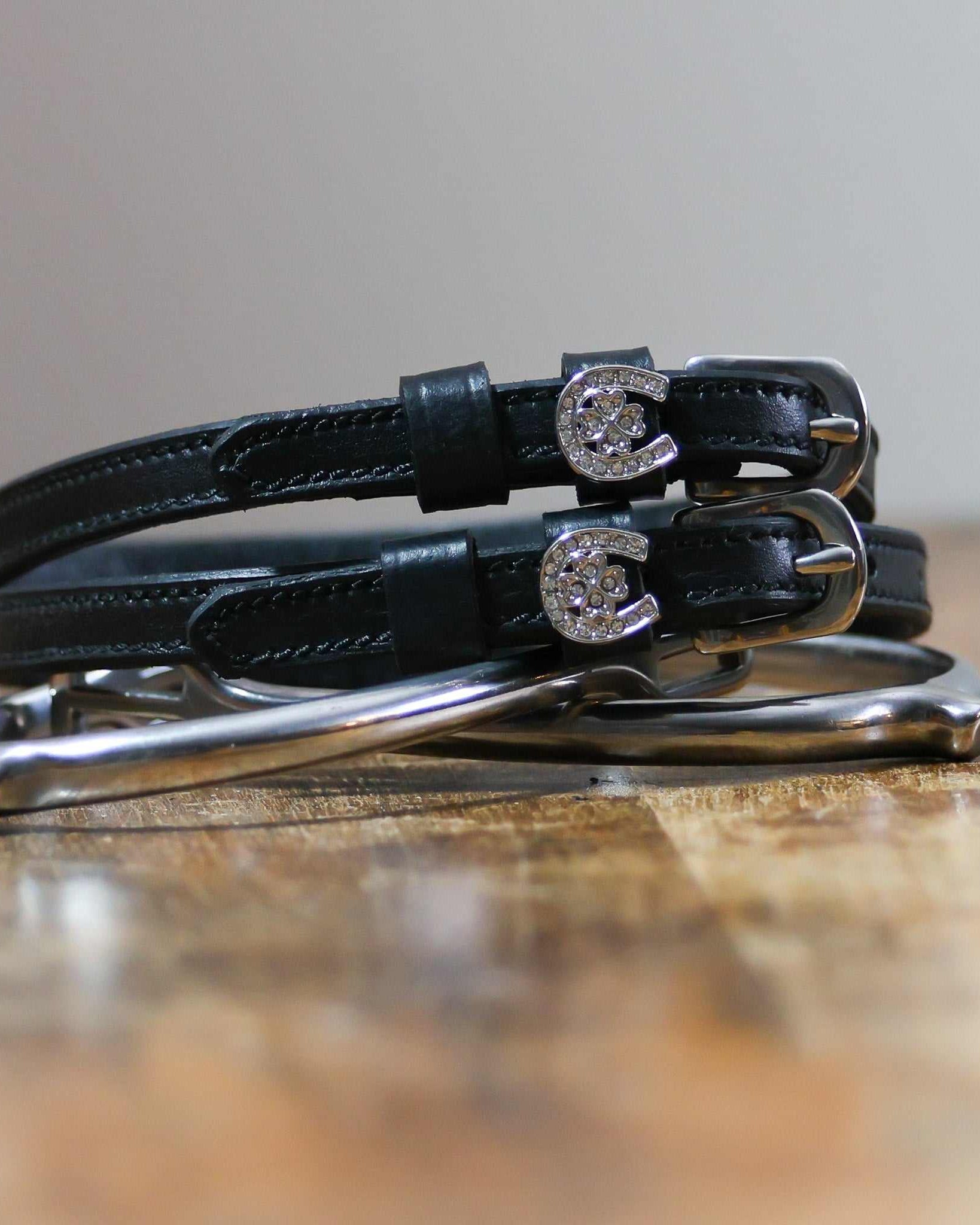 ManeJane Horse Shoe Clover Spur Straps Spur Straps — black leather, non-stretch, hero image for English riders.