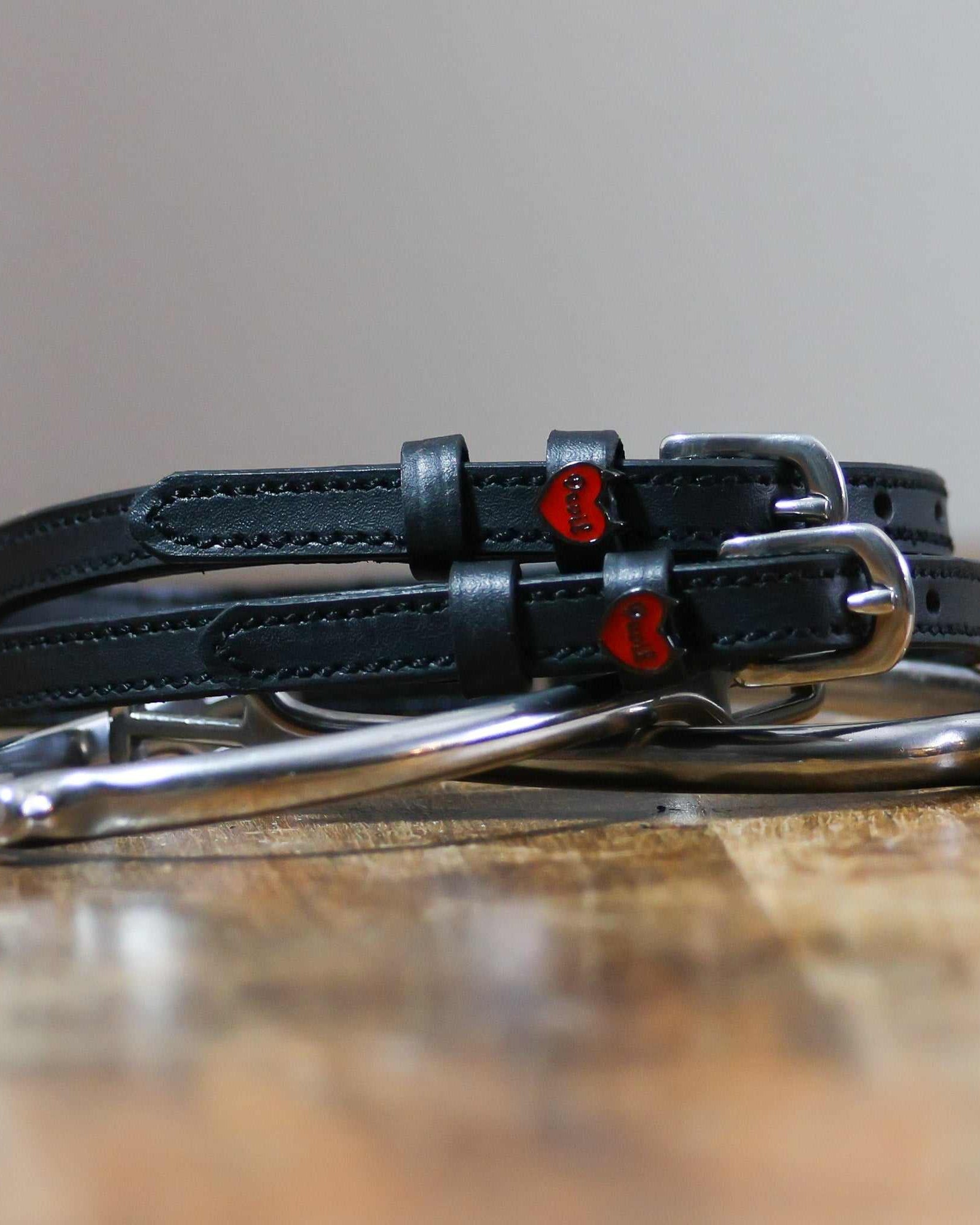 ManeJane Devil Heart Spur Straps Spur Straps — black leather, non-stretch, hero image for English riders.