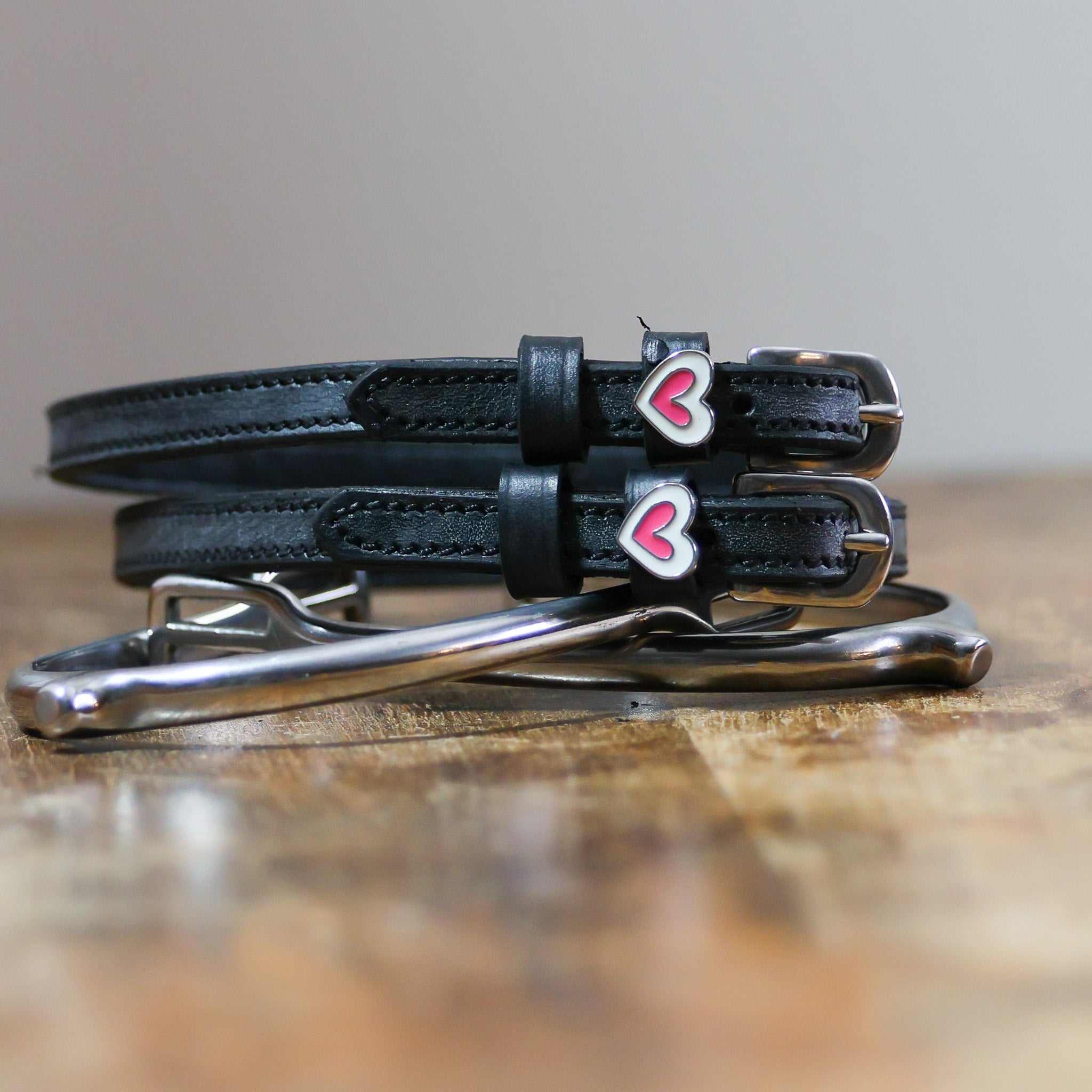ManeJane Heart Smooshes Spur Straps Spur Straps — black leather, non-stretch, hero image for English riders.