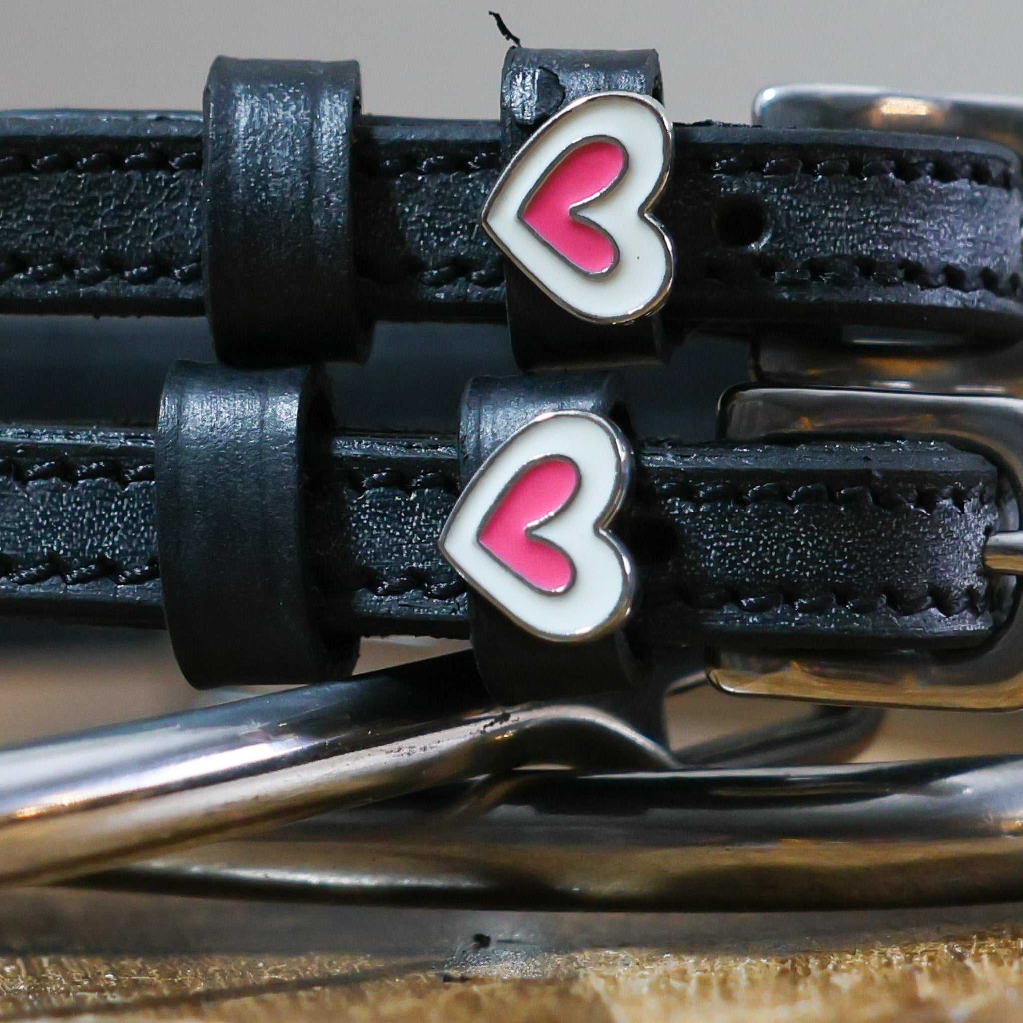 Heart Smooshes Spur Straps black leather with pink heart charm and stainless steel buckle