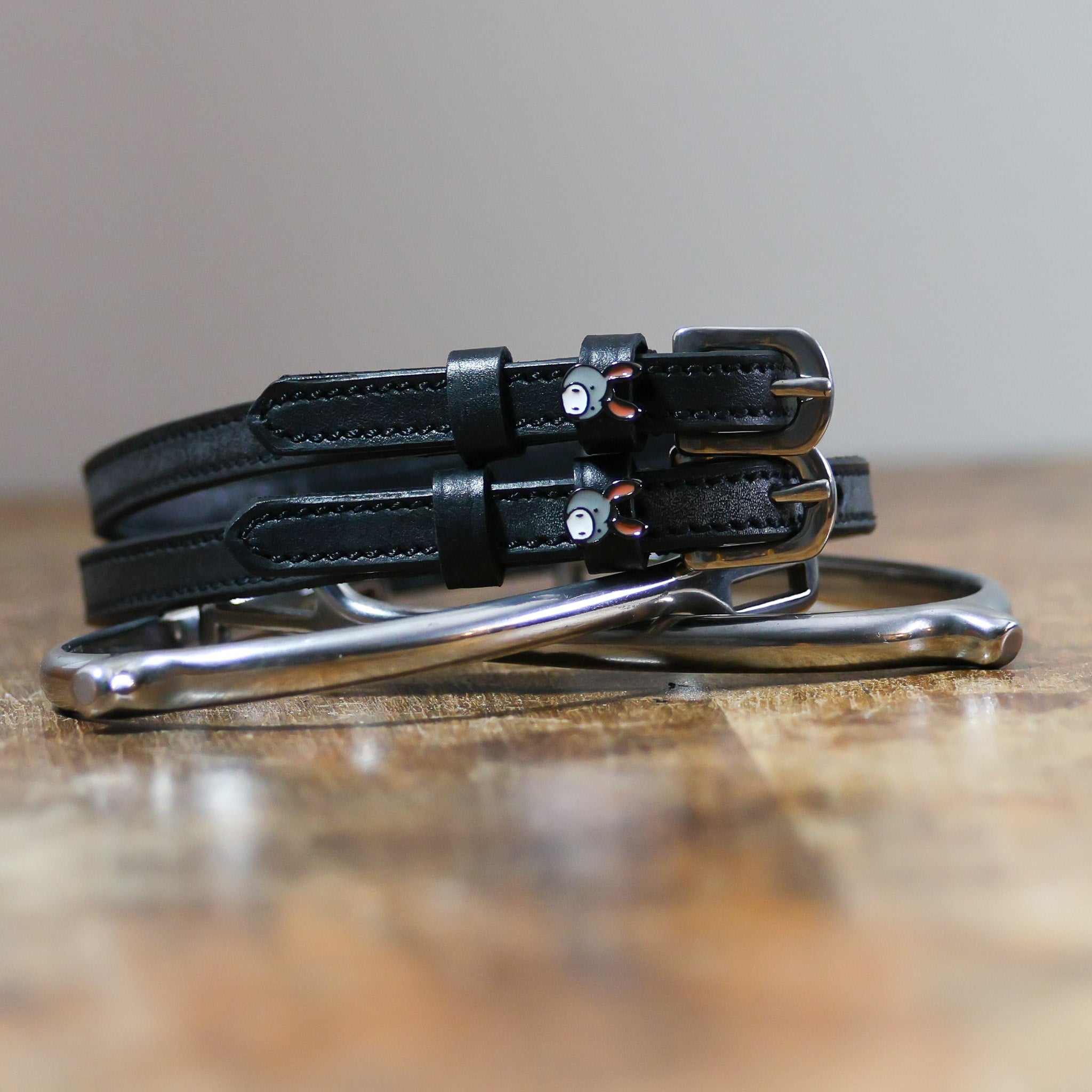 ManeJane Donkey Spur Strap Spur Straps — black leather, non-stretch, hero image for English riders.