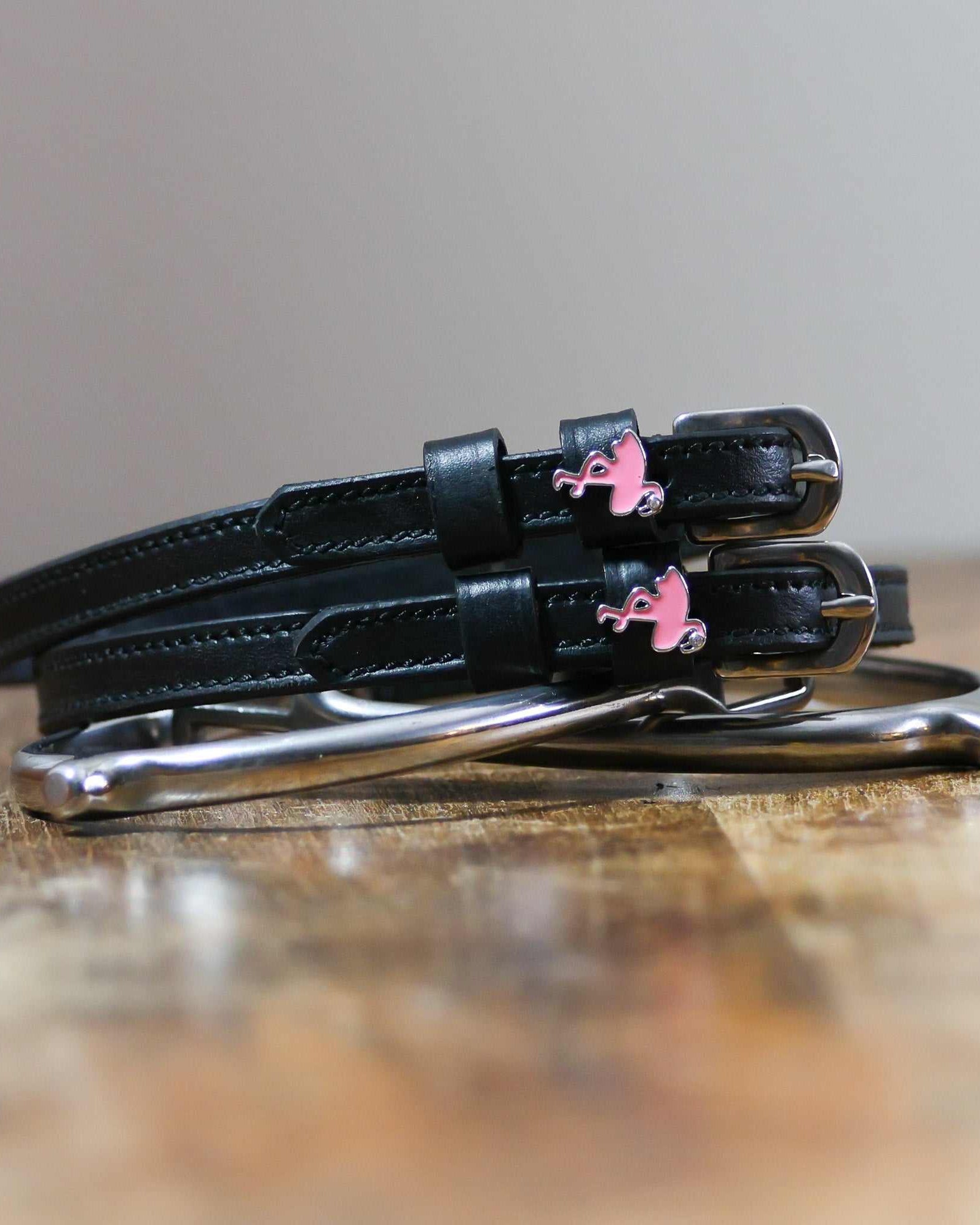 ManeJane Flamingo Spur Straps Spur Straps — black leather, non-stretch, hero image for English riders.