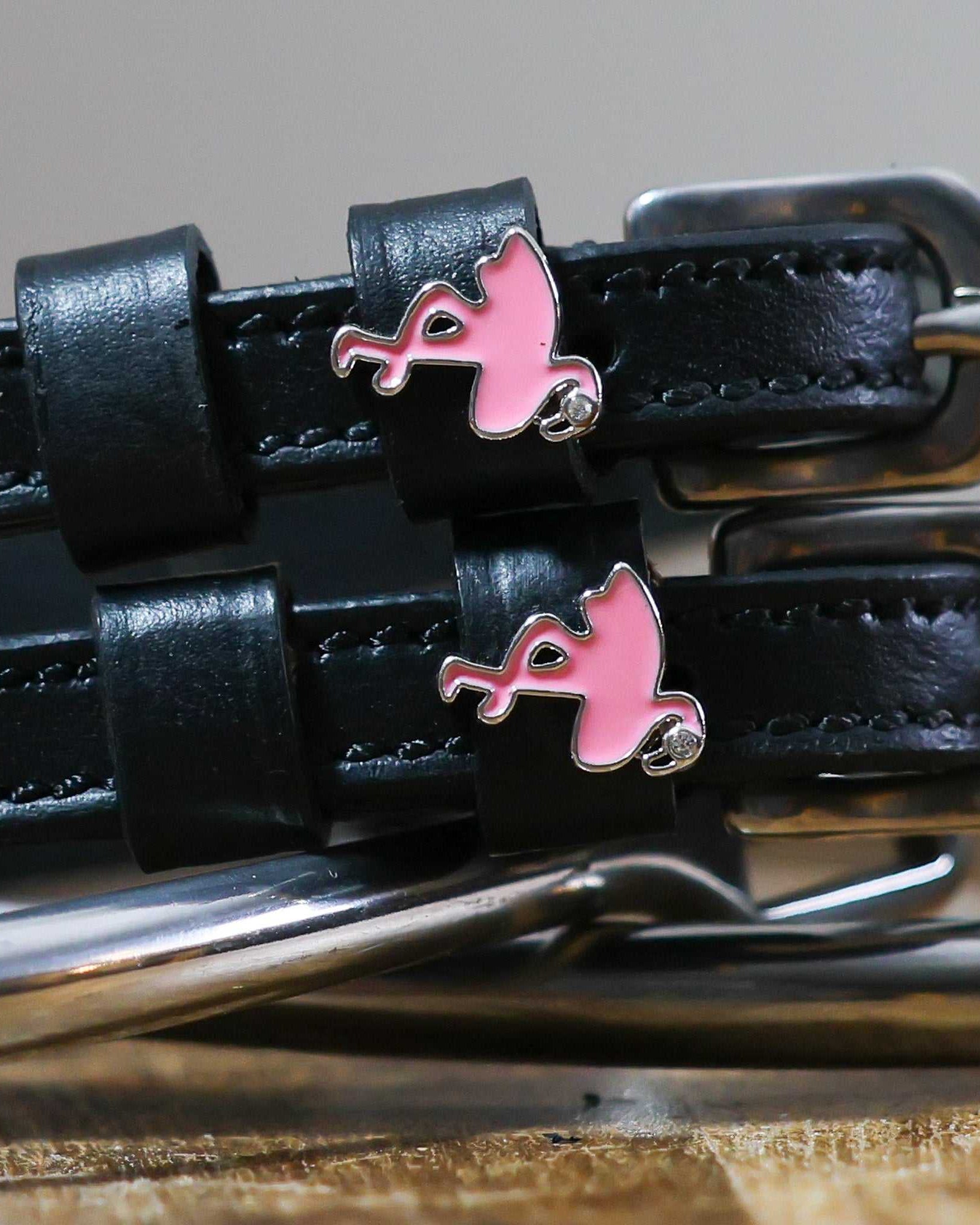 Black leather Flamingo Spur Straps with stainless steel buckles and pink flamingo charms