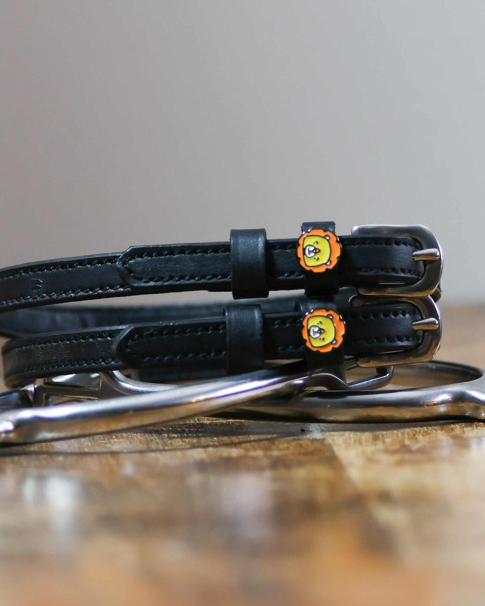 ManeJane Lion Spur Straps Spur Straps — black leather, non-stretch, hero image for English riders.