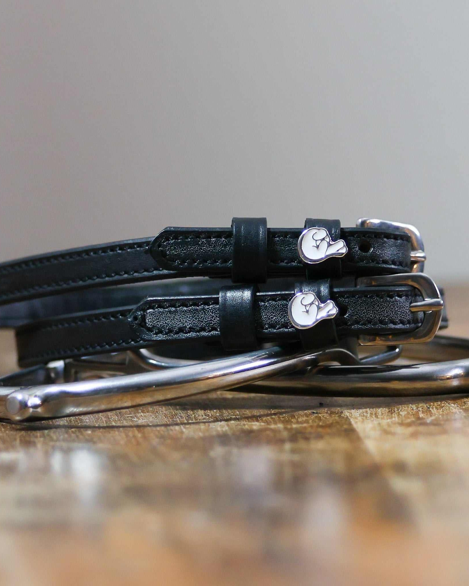 ManeJane Fingers Crossed Spur Straps Spur Straps — black leather, non-stretch, hero image for English riders.