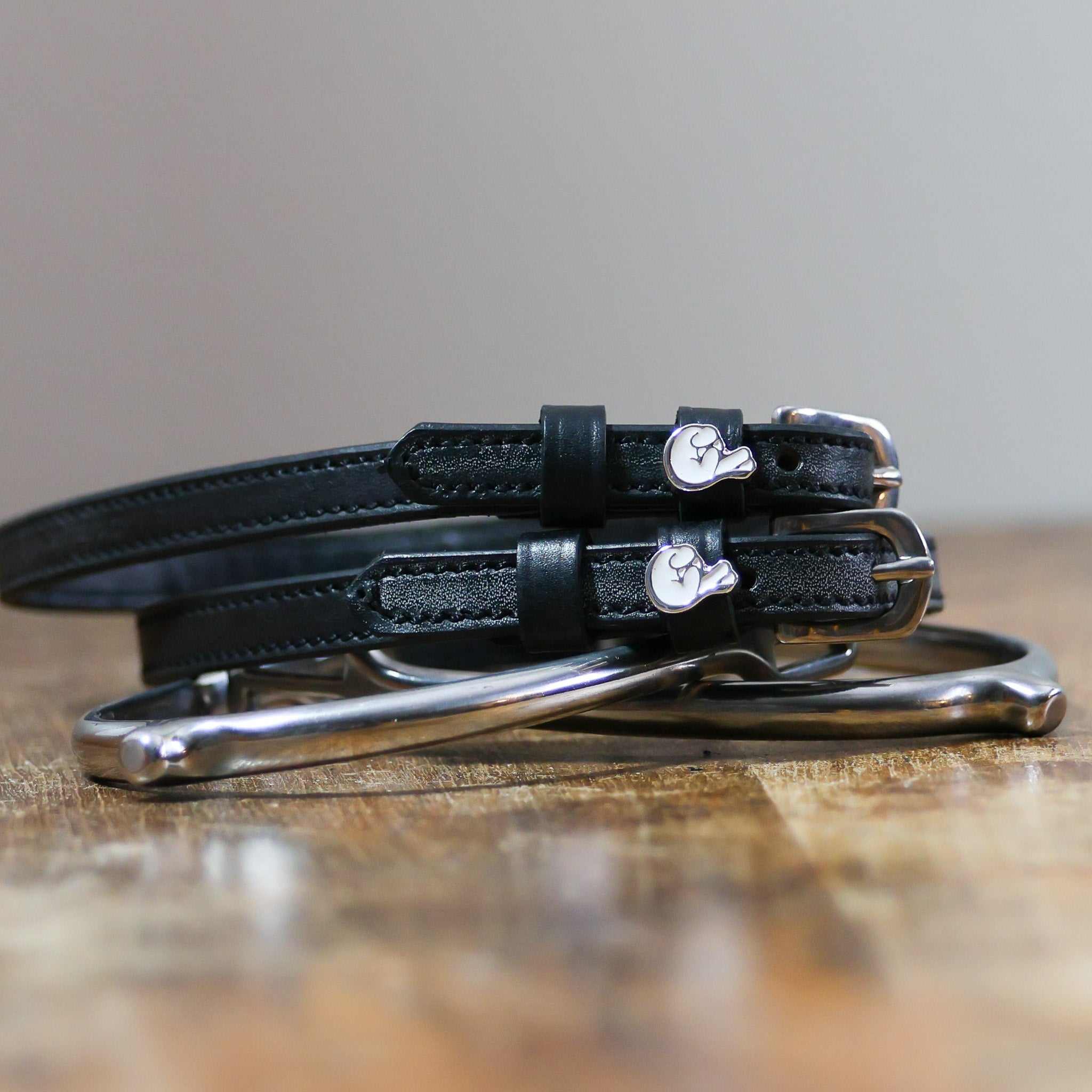 ManeJane Fingers Crossed Spur Straps Spur Straps — black leather, non-stretch, hero image for English riders.