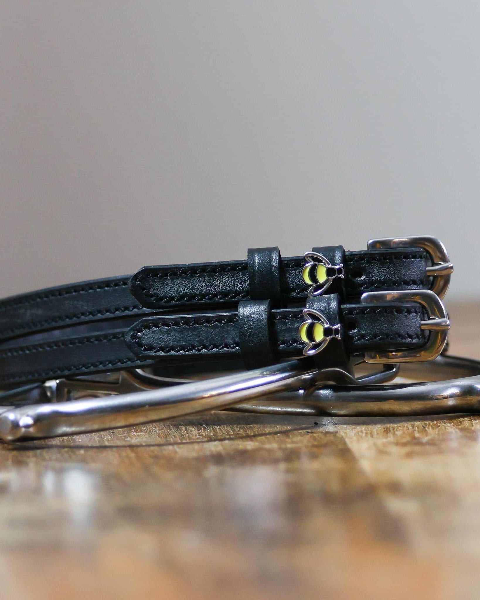 ManeJane Bee Spur Straps Spur Straps — black leather, non-stretch, hero image for English riders.
