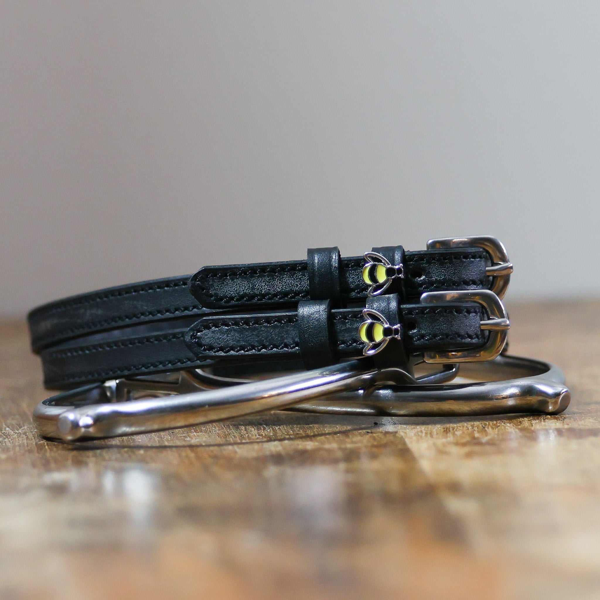 ManeJane Bee Spur Straps Spur Straps — black leather, non-stretch, hero image for English riders.