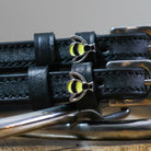 Black leather Bee Spur Straps with stainless steel buckles and custom bee charms