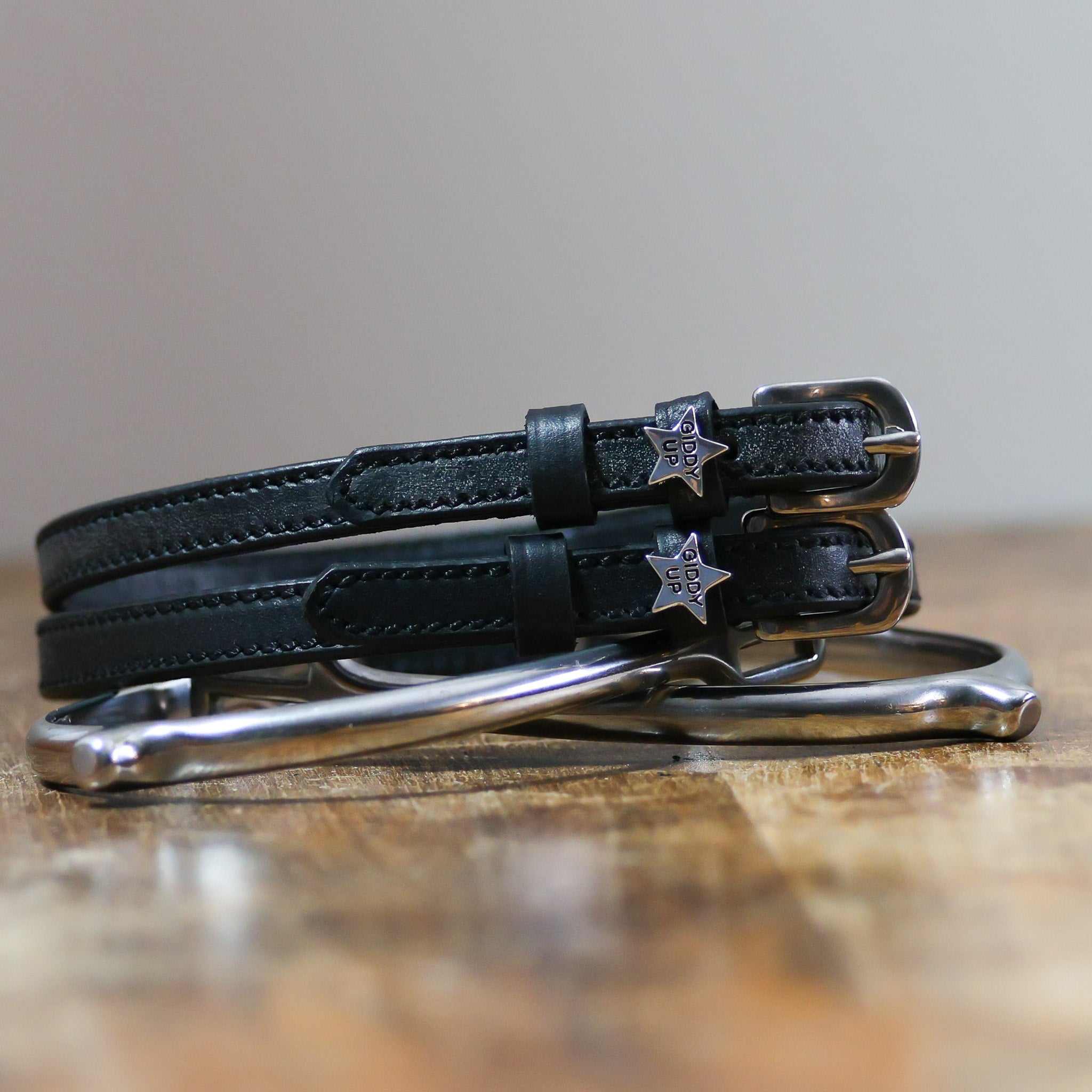 ManeJane Giddy Up Spur Straps Spur Straps — black leather, non-stretch, hero image for English riders.
