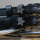 Giddy Up Spur Straps made of black leather with stainless steel buckles and star-shaped custom charms